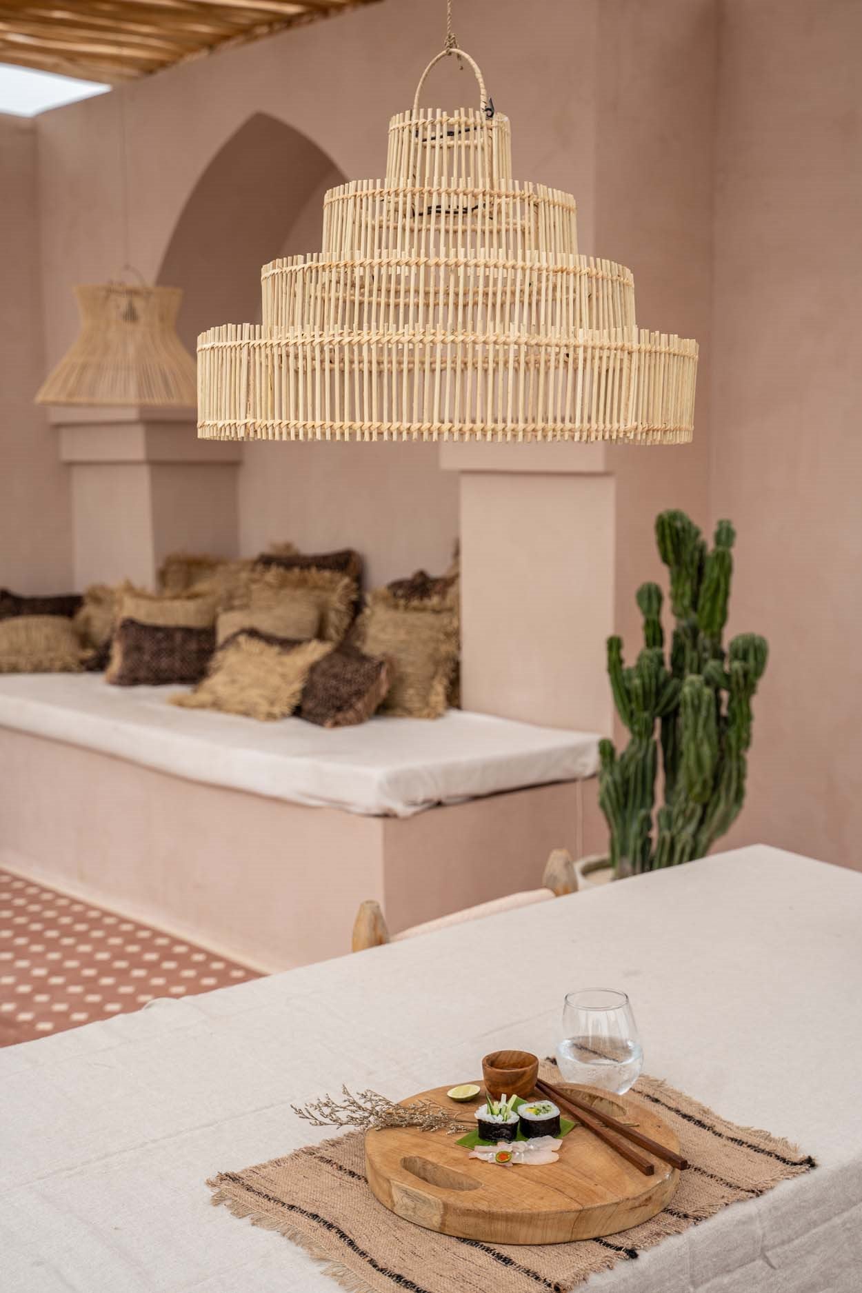 Natural rattan pendant lamp with wedding cake shape, ideal for dining or coffee table lighting