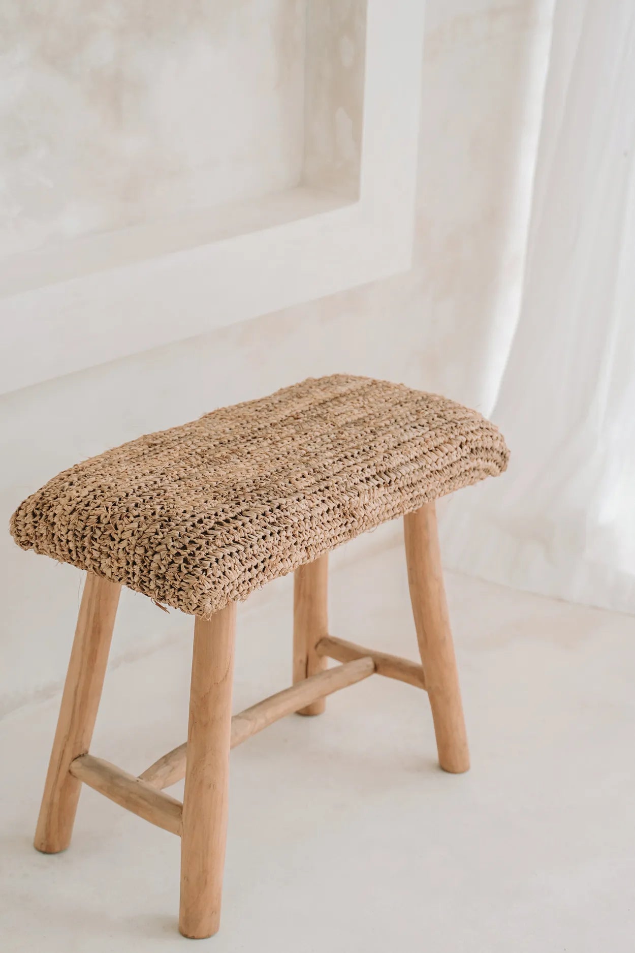 Boho-chic raffia and teak bench for indoor or covered outdoor use