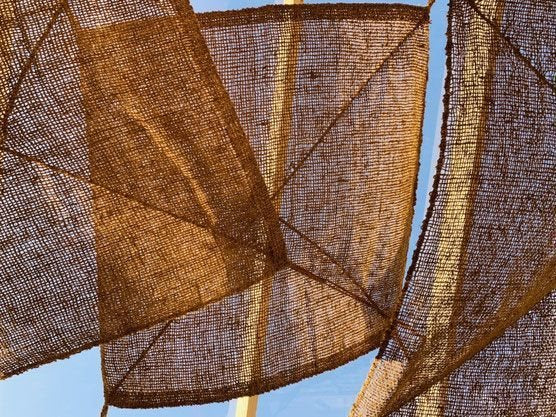 Rustic rectangular outdoor sun shade – tropical-inspired shade made with coconut fiber