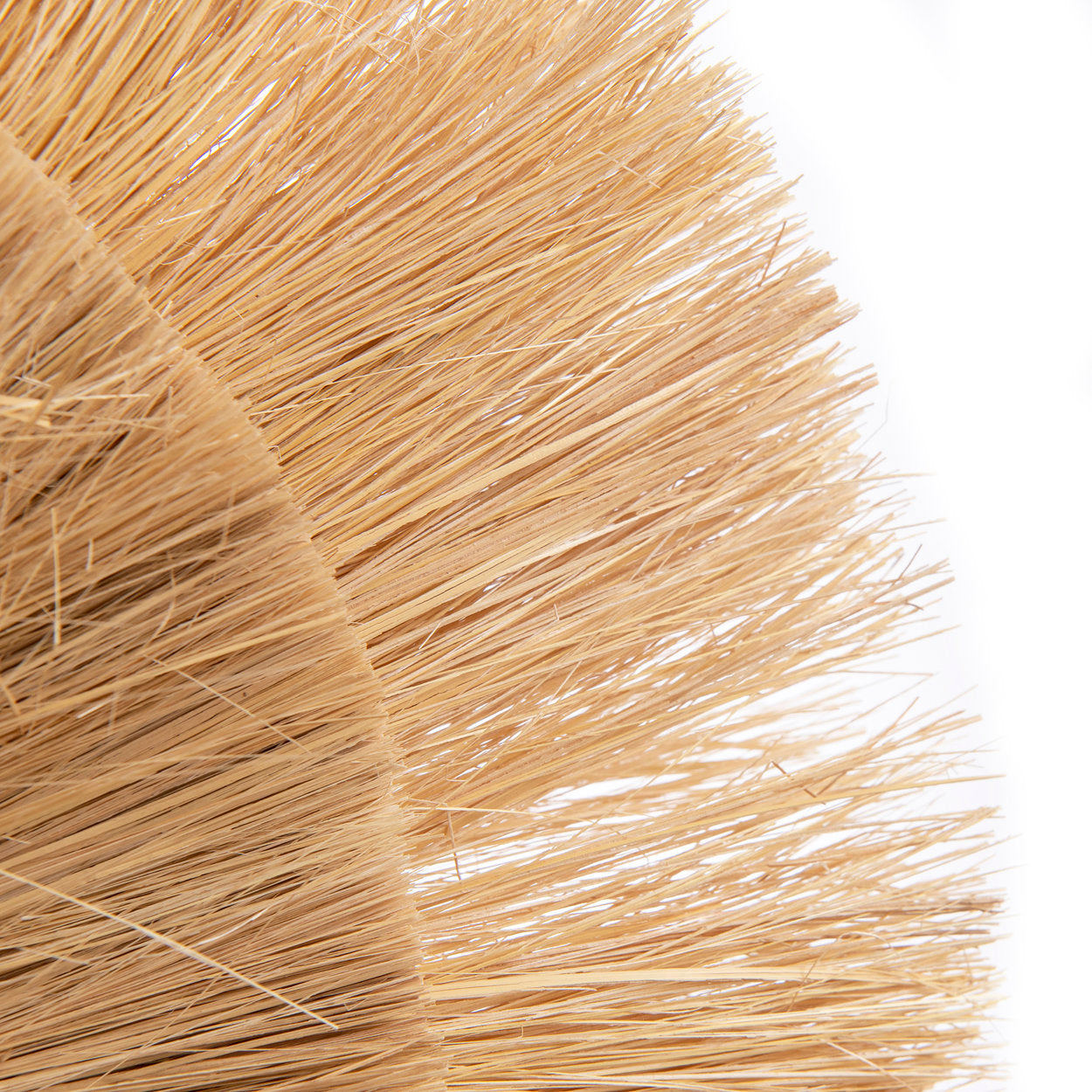 Medium-sized grass wall lamp shown beside a natural wood console table, creating a calm and earthy atmosphere.