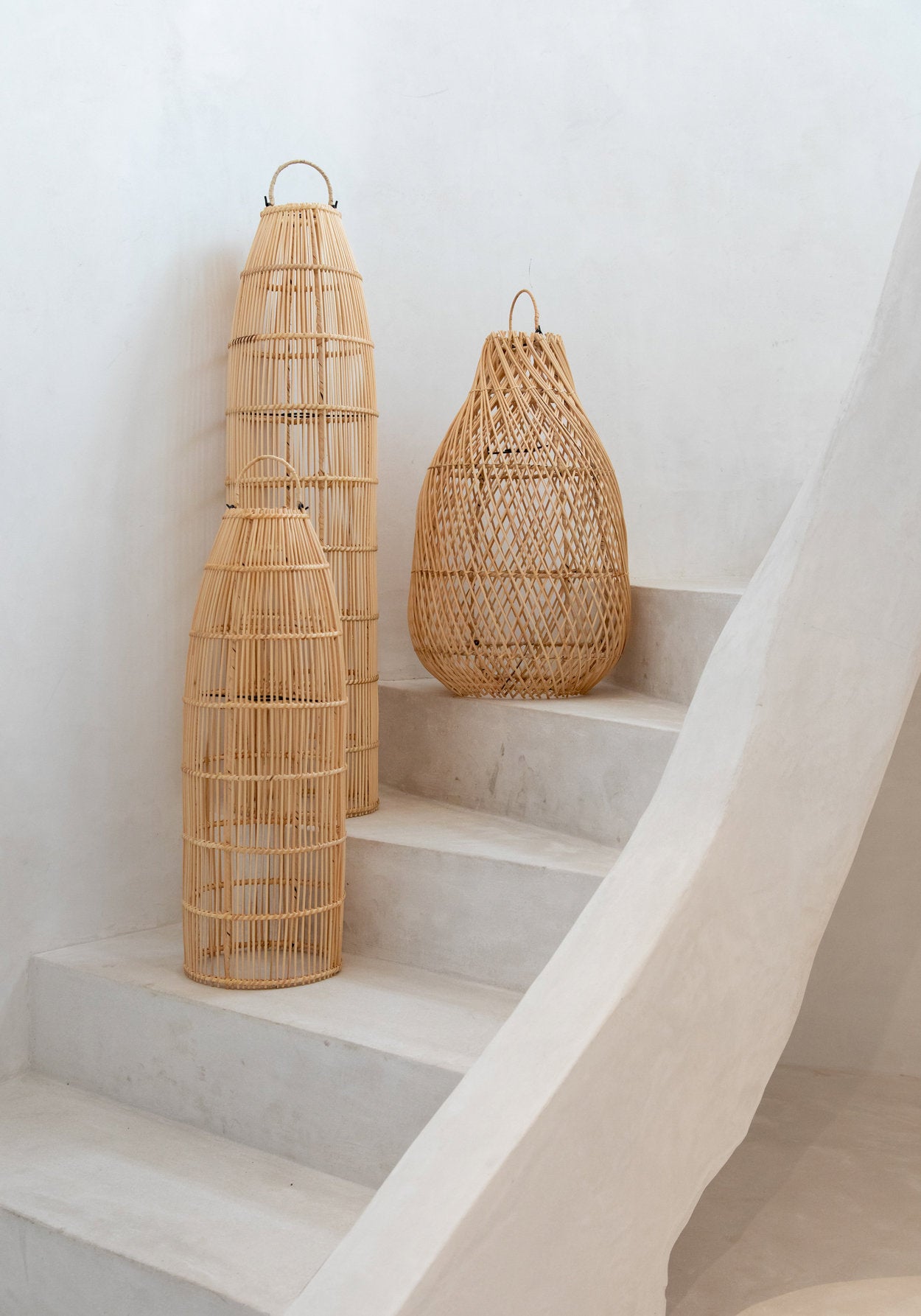 Handwoven rattan pendant light in medium size, ideal for ceiling or decorative floor display