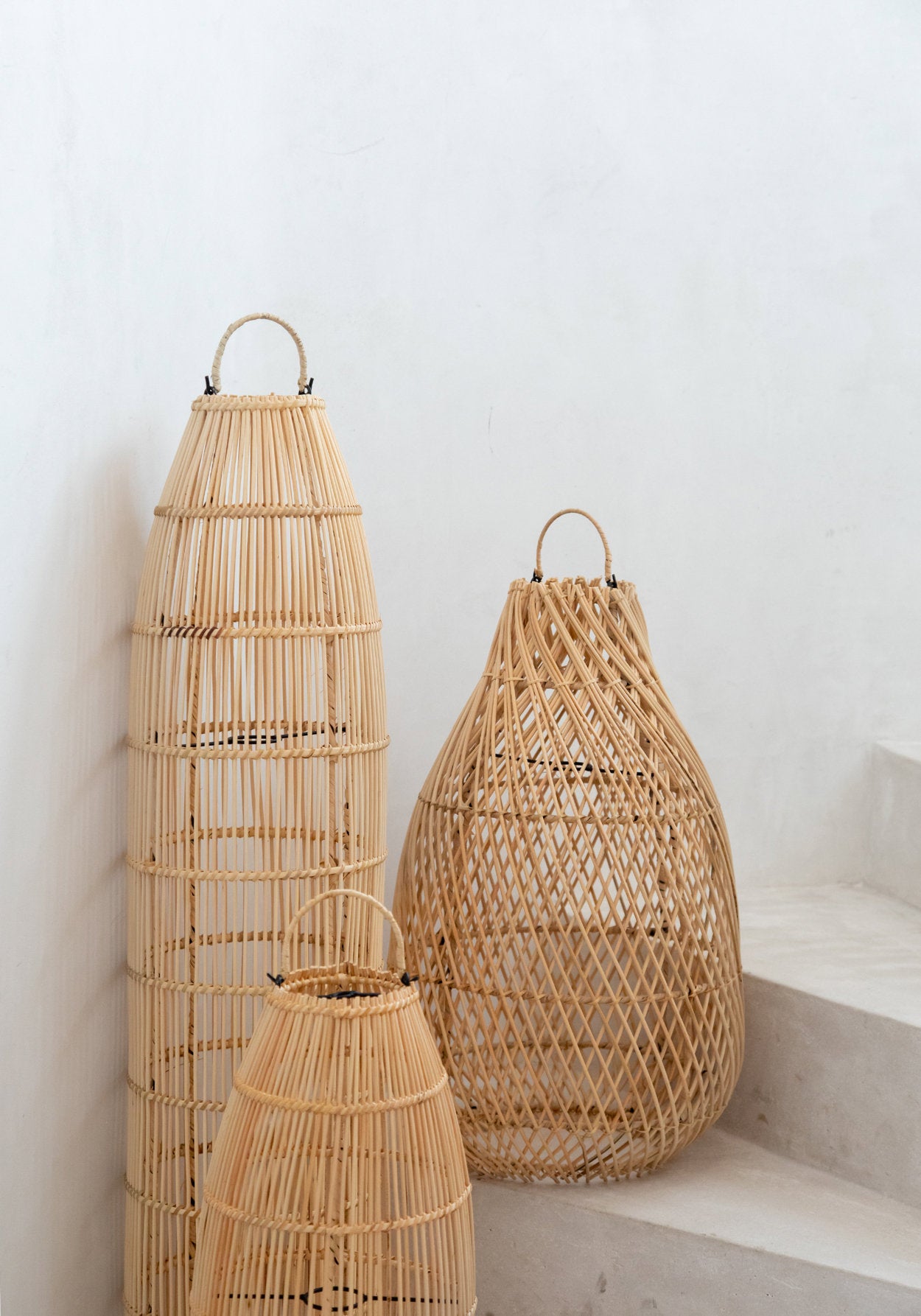 Natural pendant light with intricate rattan pattern, adding warmth to bedrooms or living areas