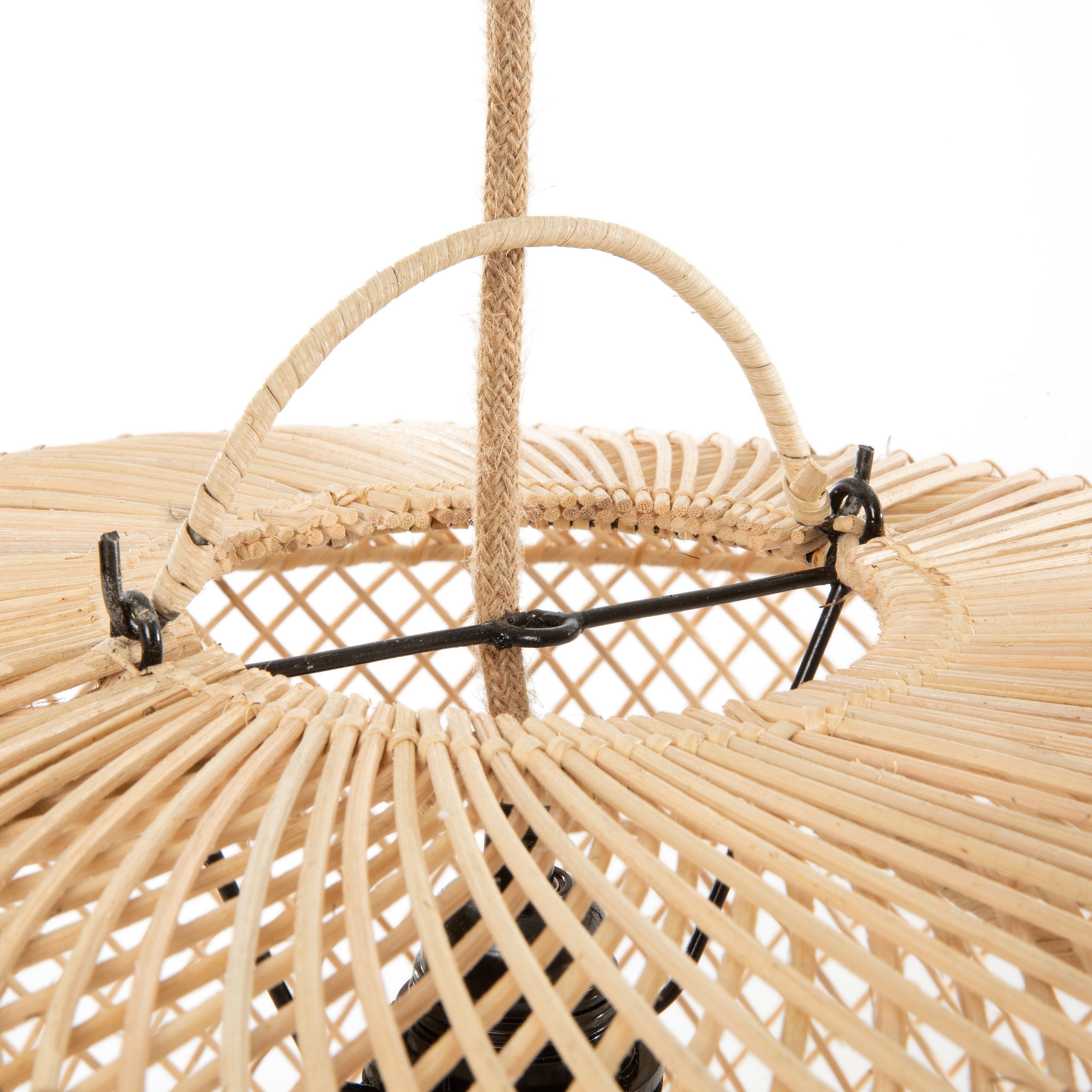Light dances through the rattan weave, bringing warmth and movement to neutral-toned rooms.