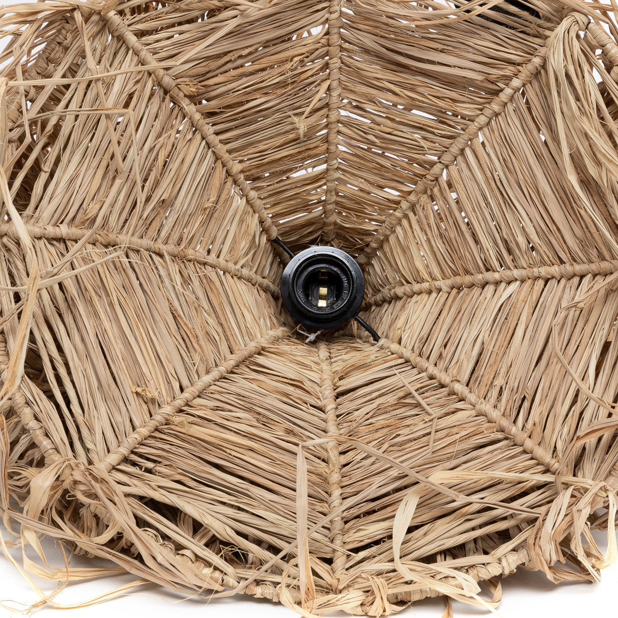 Boho rattan pendant light with flowing raffia, adding warm island mood to modern ceilings