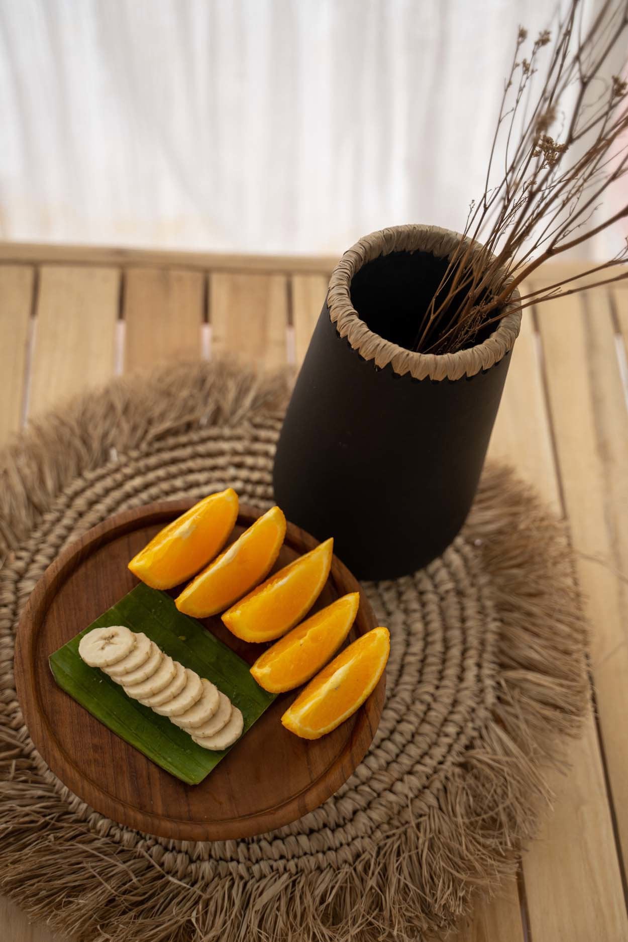 Round seagrass raffia placemat, eco-friendly and durable, designed to complement casual or formal meals.