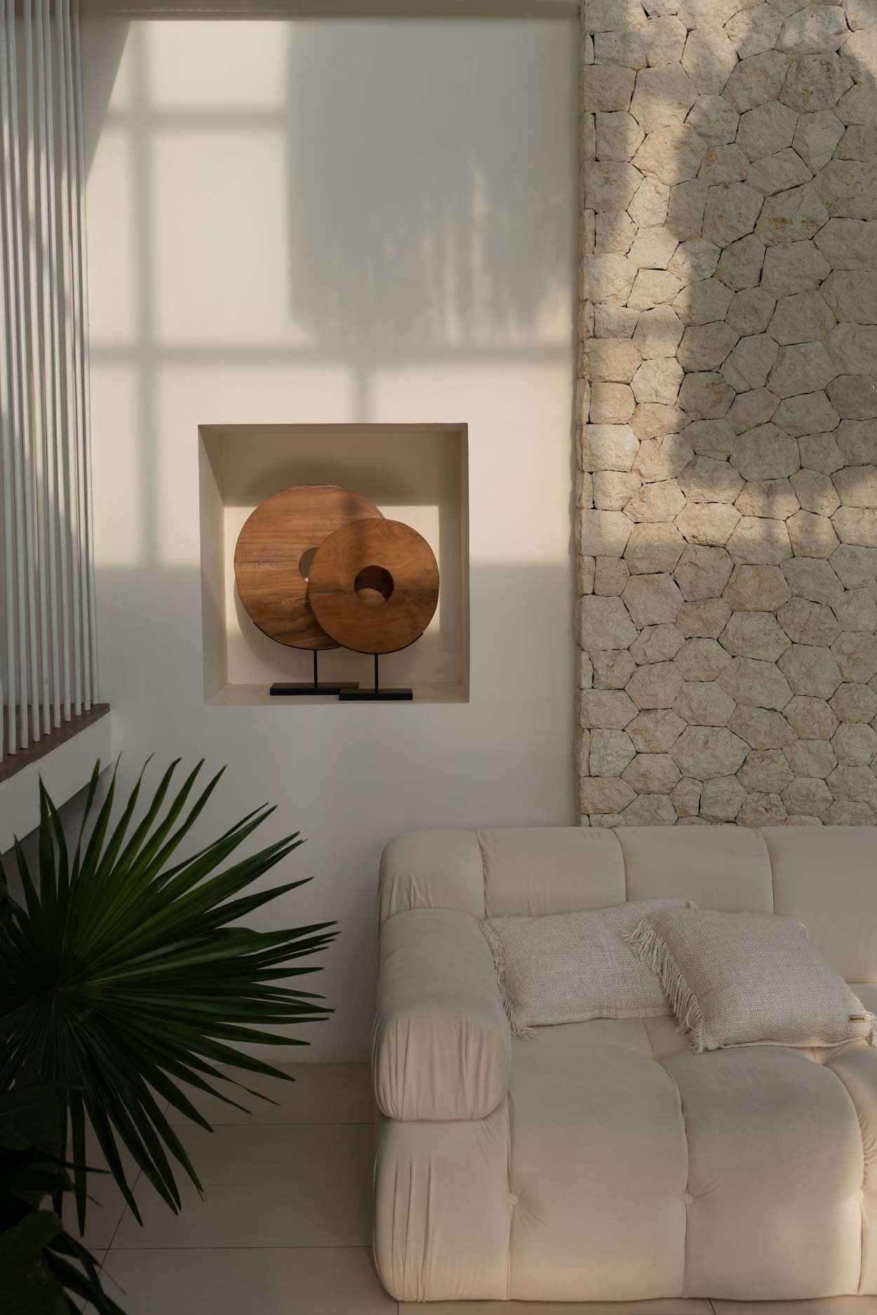 Medium teak wood disc sculpture with natural grain patterns