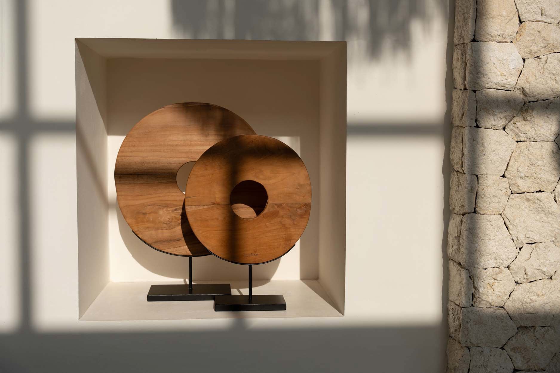 Handcrafted teak disc decor piece for modern or rustic interiors