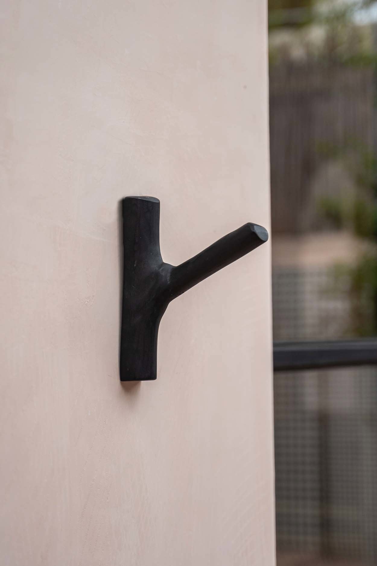 Decorative black wood wall hook for a refined and practical touch