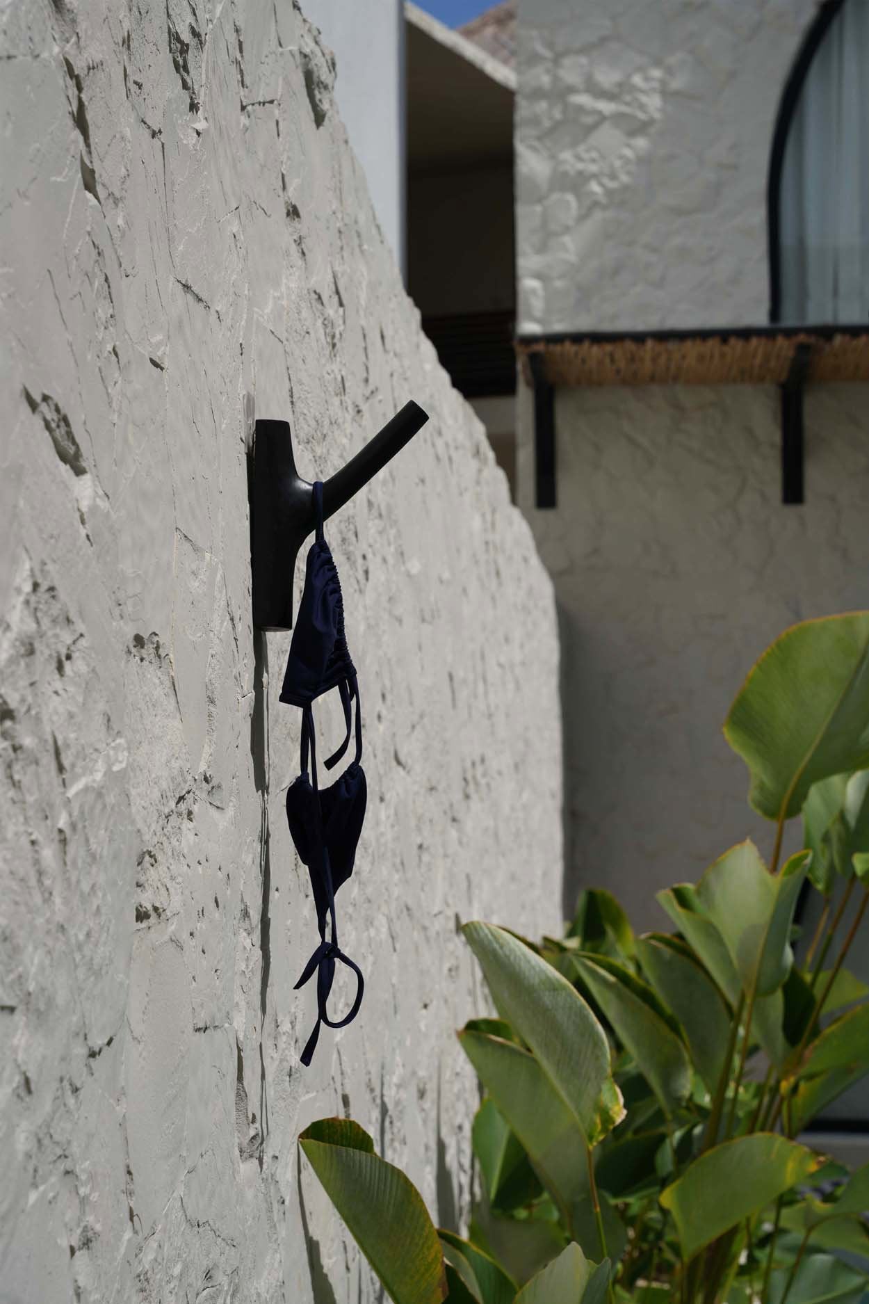 Wall-mounted black teak hook for coats, bags, and towels