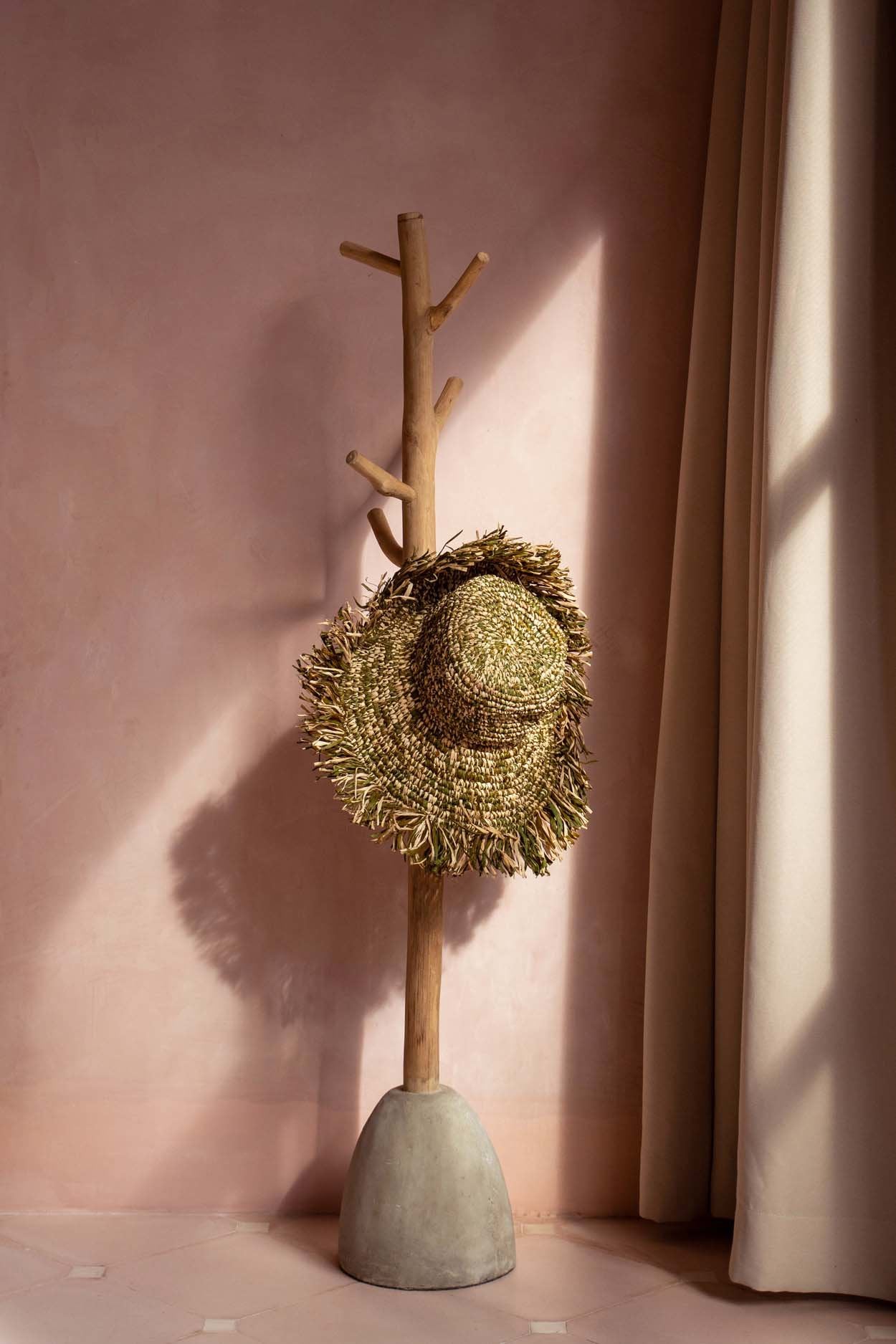 Solid teak and concrete standing coat rack for boho-inspired homes