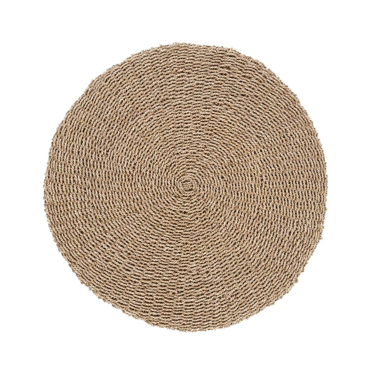 Round sisal rug handcrafted from natural fibers, perfect for boho-inspired spaces.
