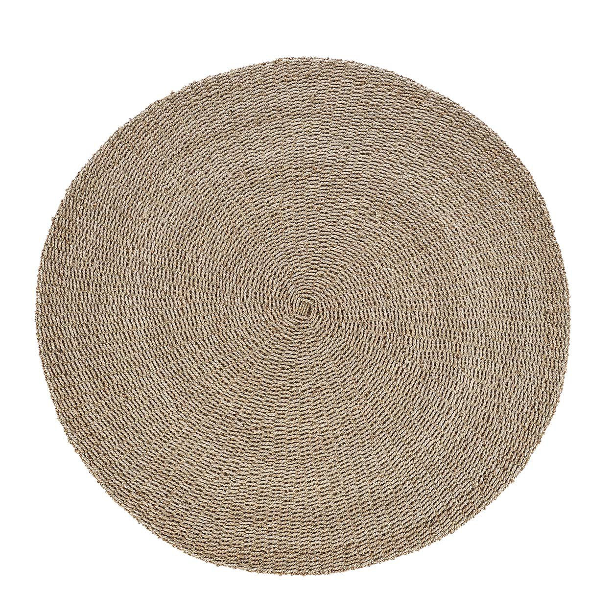 Round sizal carpet made from natural fibers, perfect for adding texture to your living room.