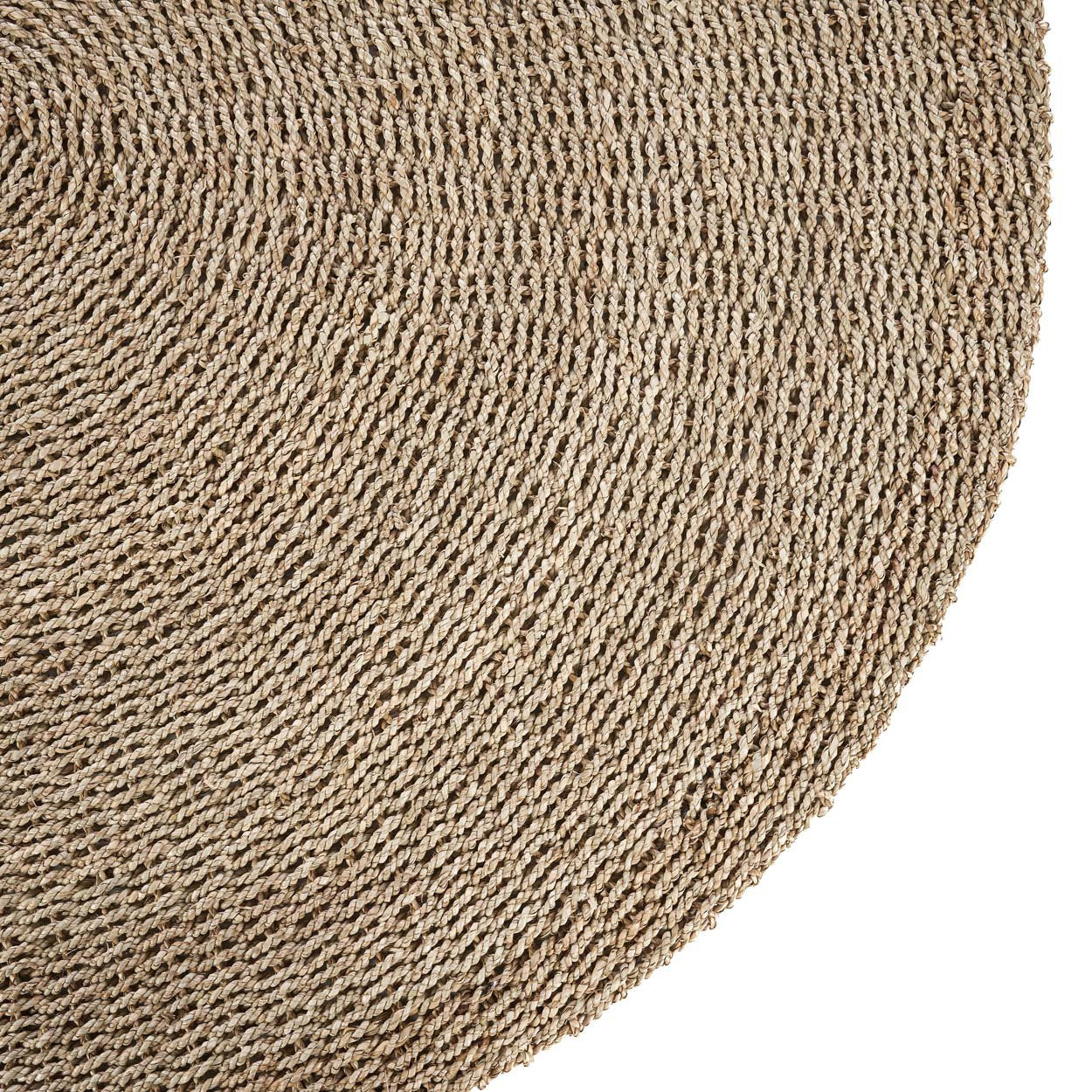 Eco-friendly sizal rug in a large round shape, ideal for boho or rustic interiors.