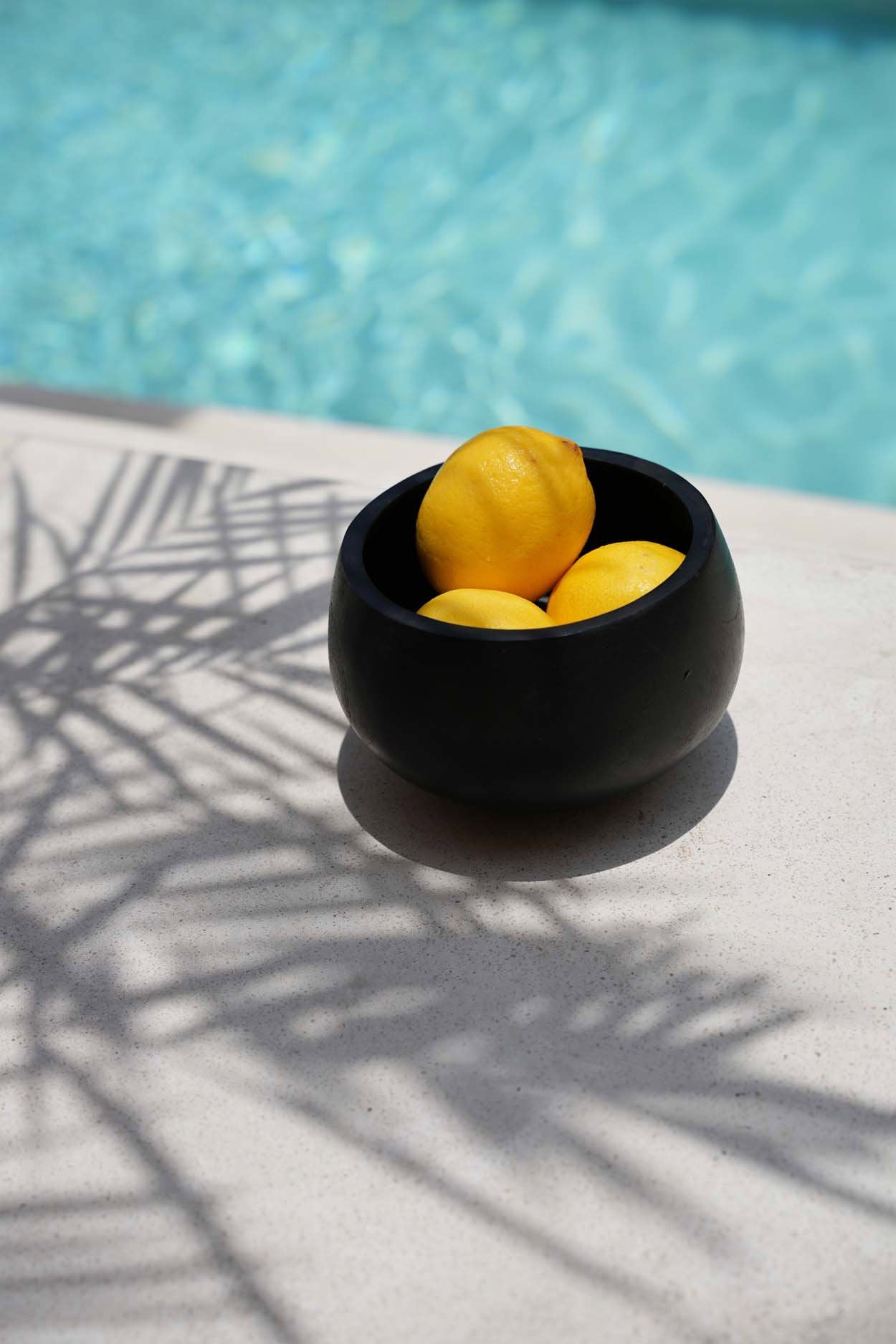 Rustic black serving bowl with a sleek matte finish, ideal for light bites and stylish table settings.