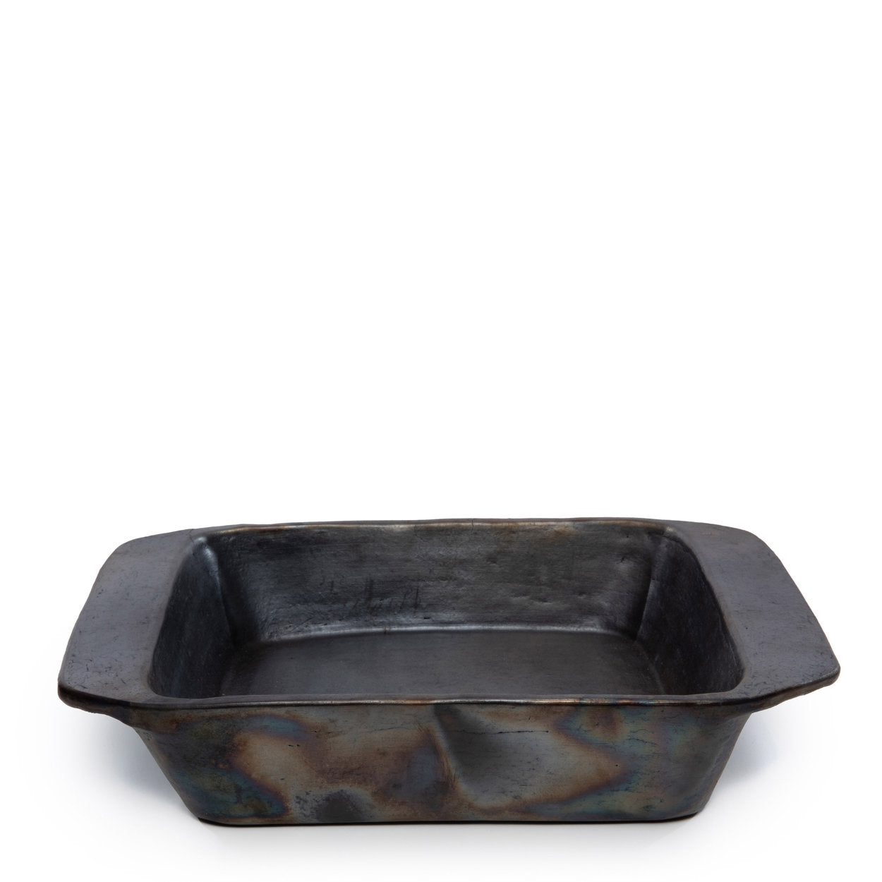 The Burned Oven Tray in black, handmade terracotta ceramic oven dish for family meals.