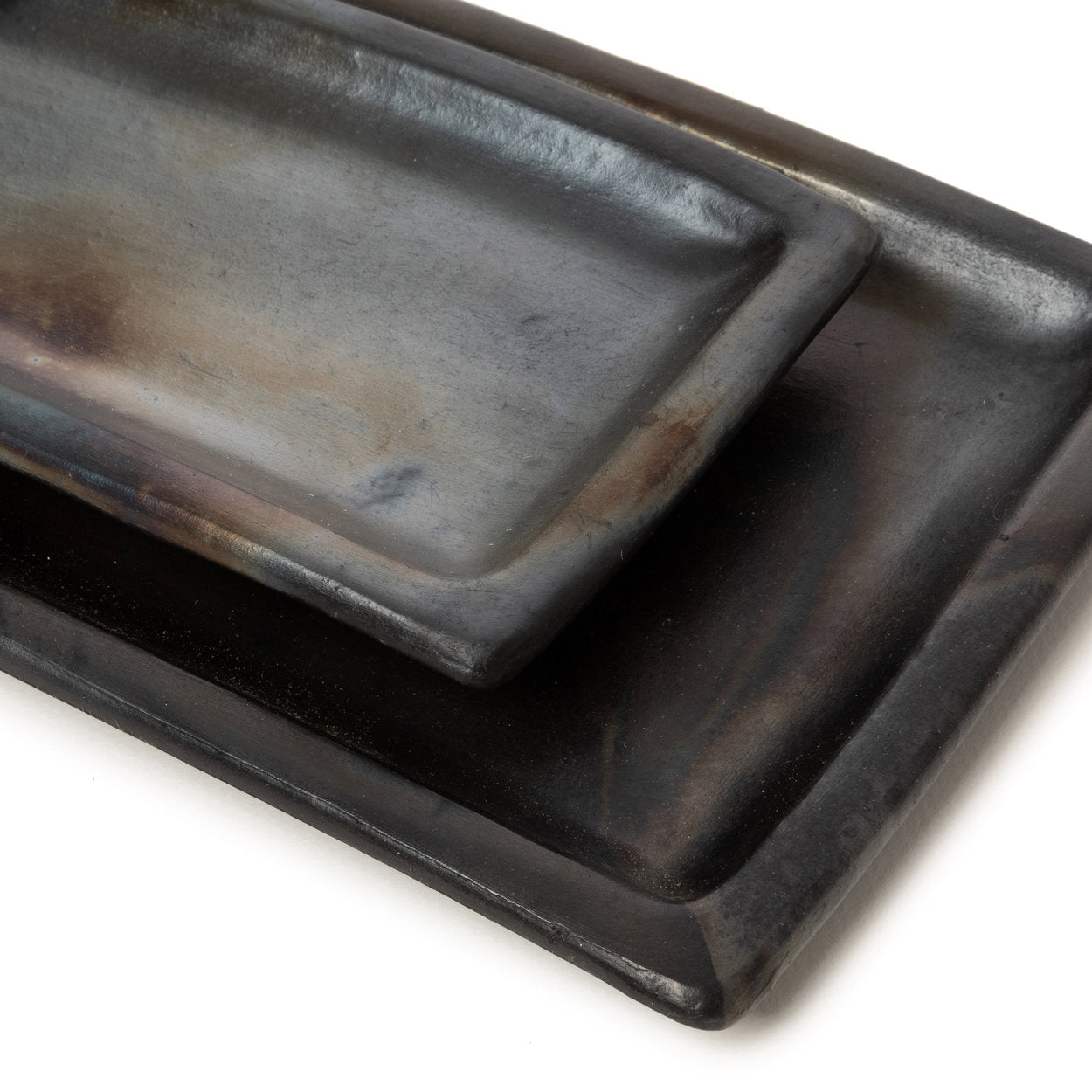 Artisanal large sushi plate in black terracotta, perfect for sushi, cakes, or tapas servings.