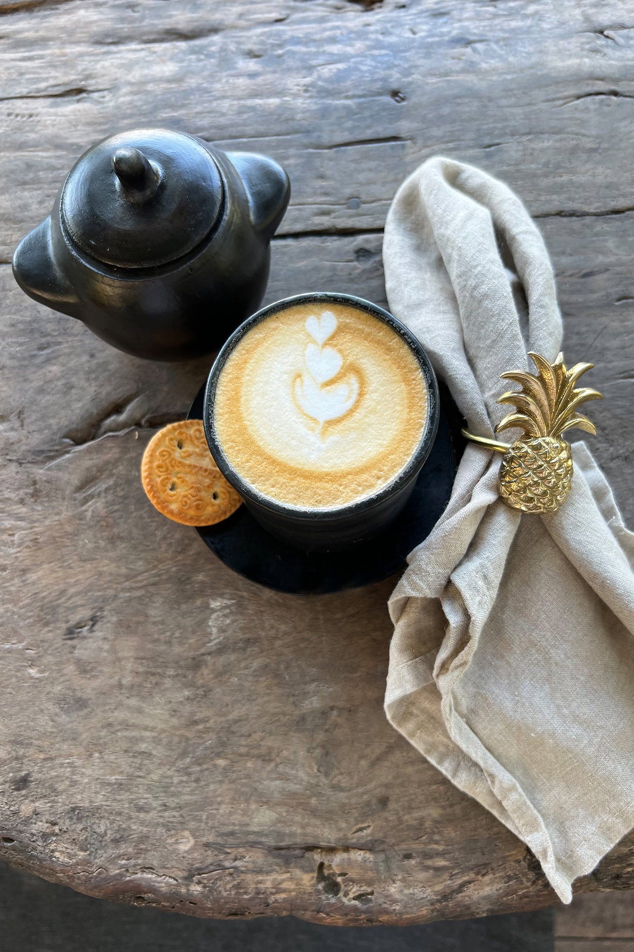 Medium ceramic storage jar in matte black, handcrafted with unique artisanal details.