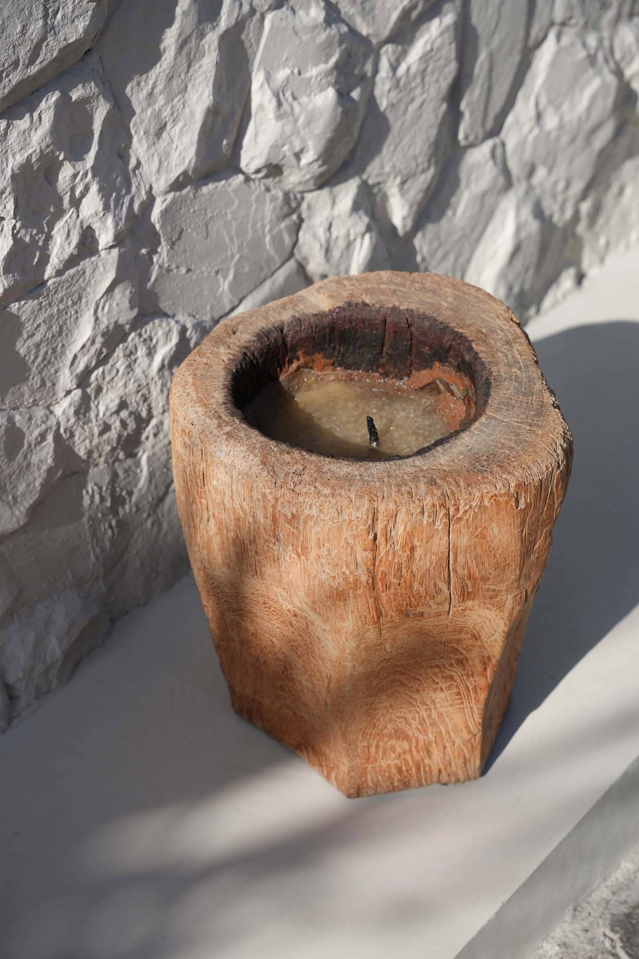 Unique rustic candle holder made from repurposed rice-stamping pots