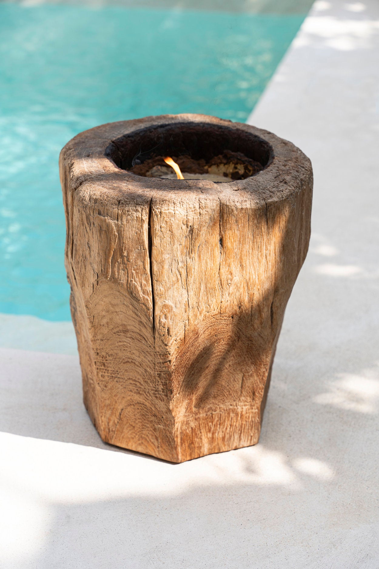 Natural wood candle trunk filled with wax for long-lasting glow