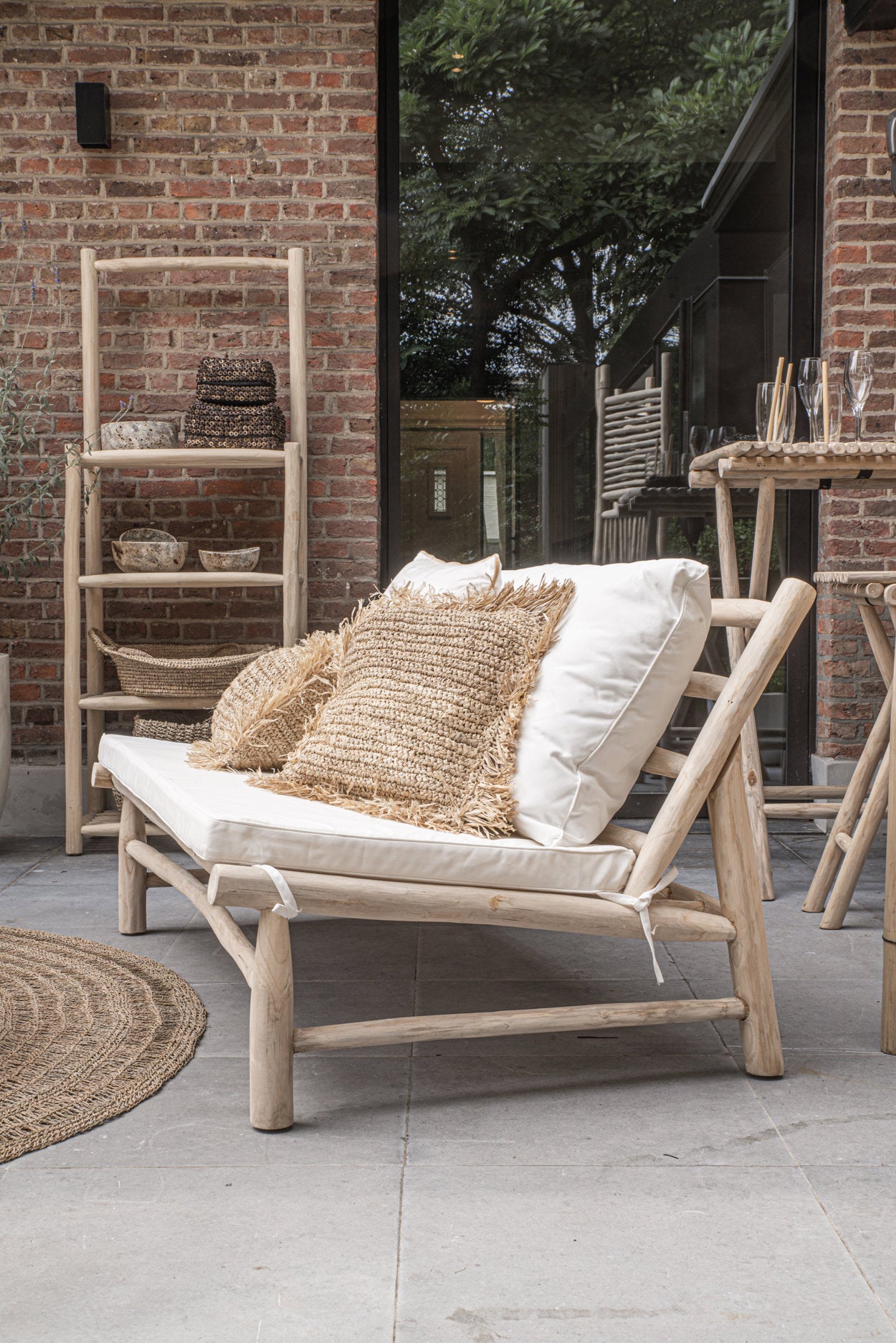 Natural wood loveseat with curved frame and minimalist cushions