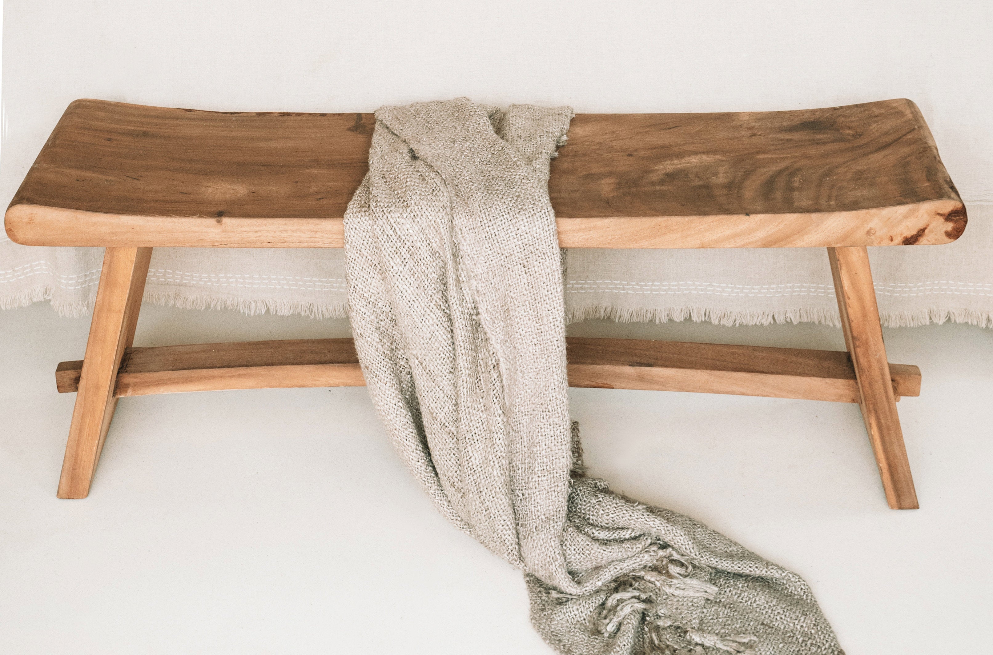 Boho chic 120 cm Suar wood bench, perfect for adding warmth to any space