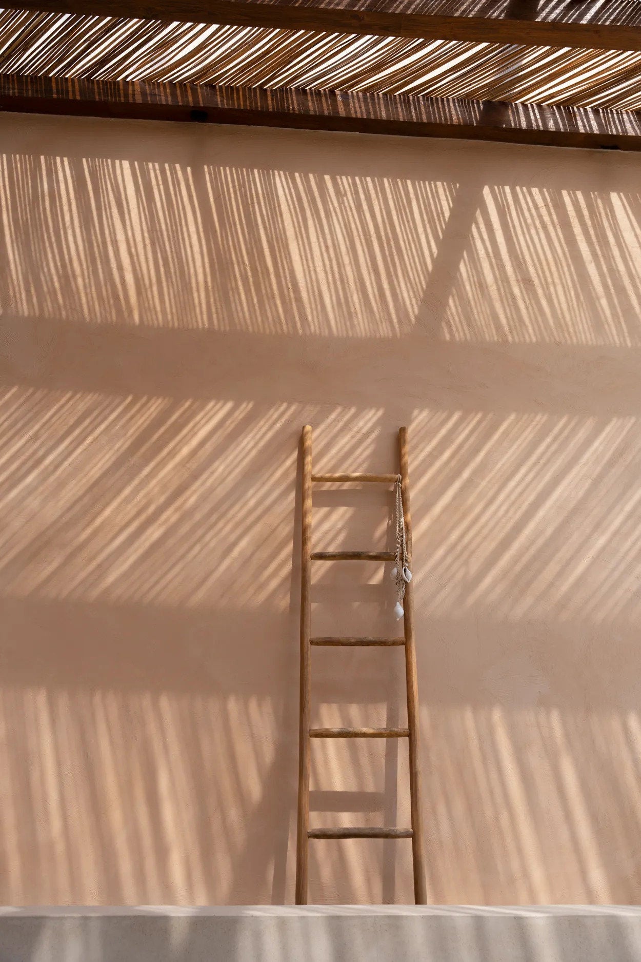 Functional teak ladder to hang blankets or robes with style