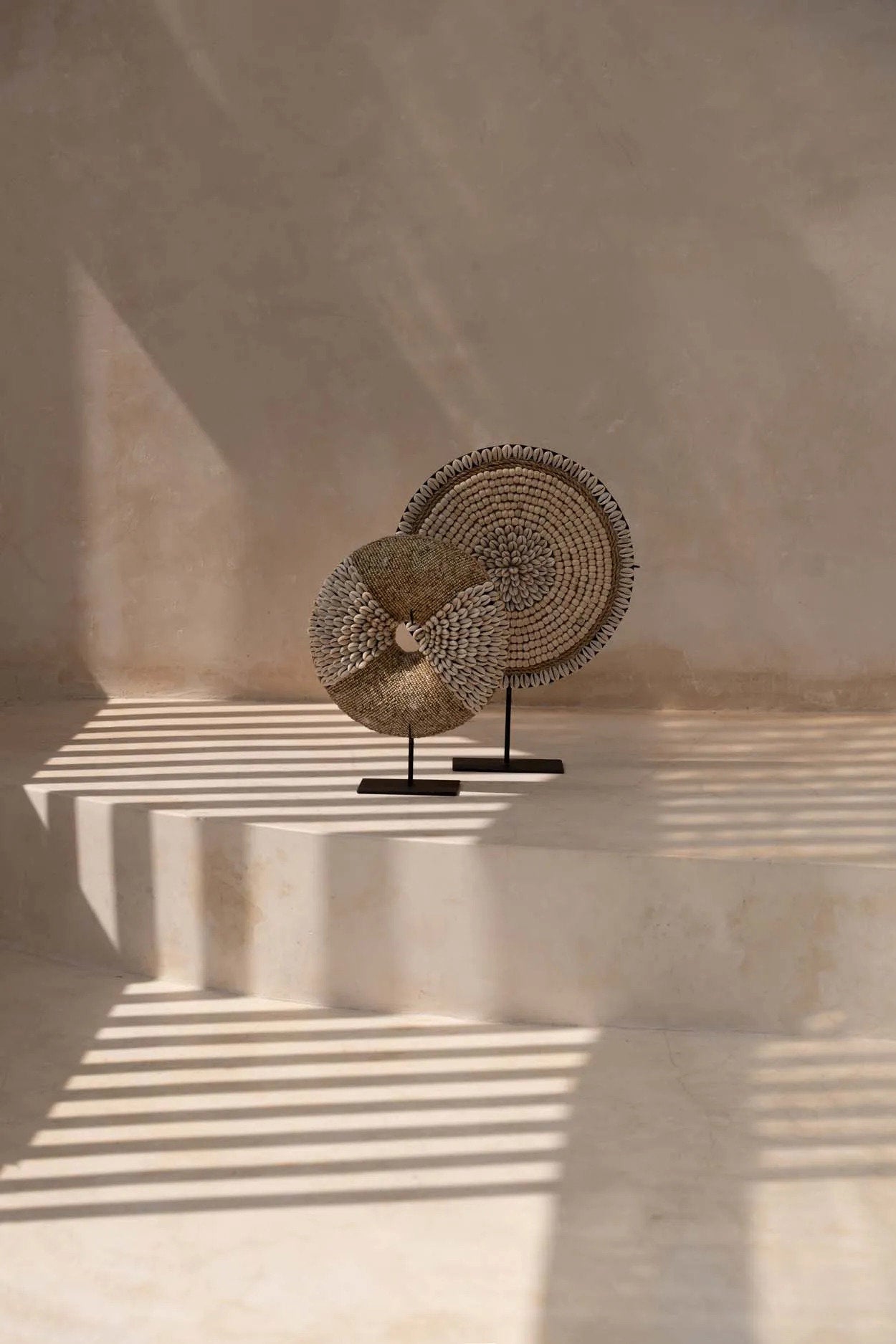 Boho-inspired natural shell ornament on metal base