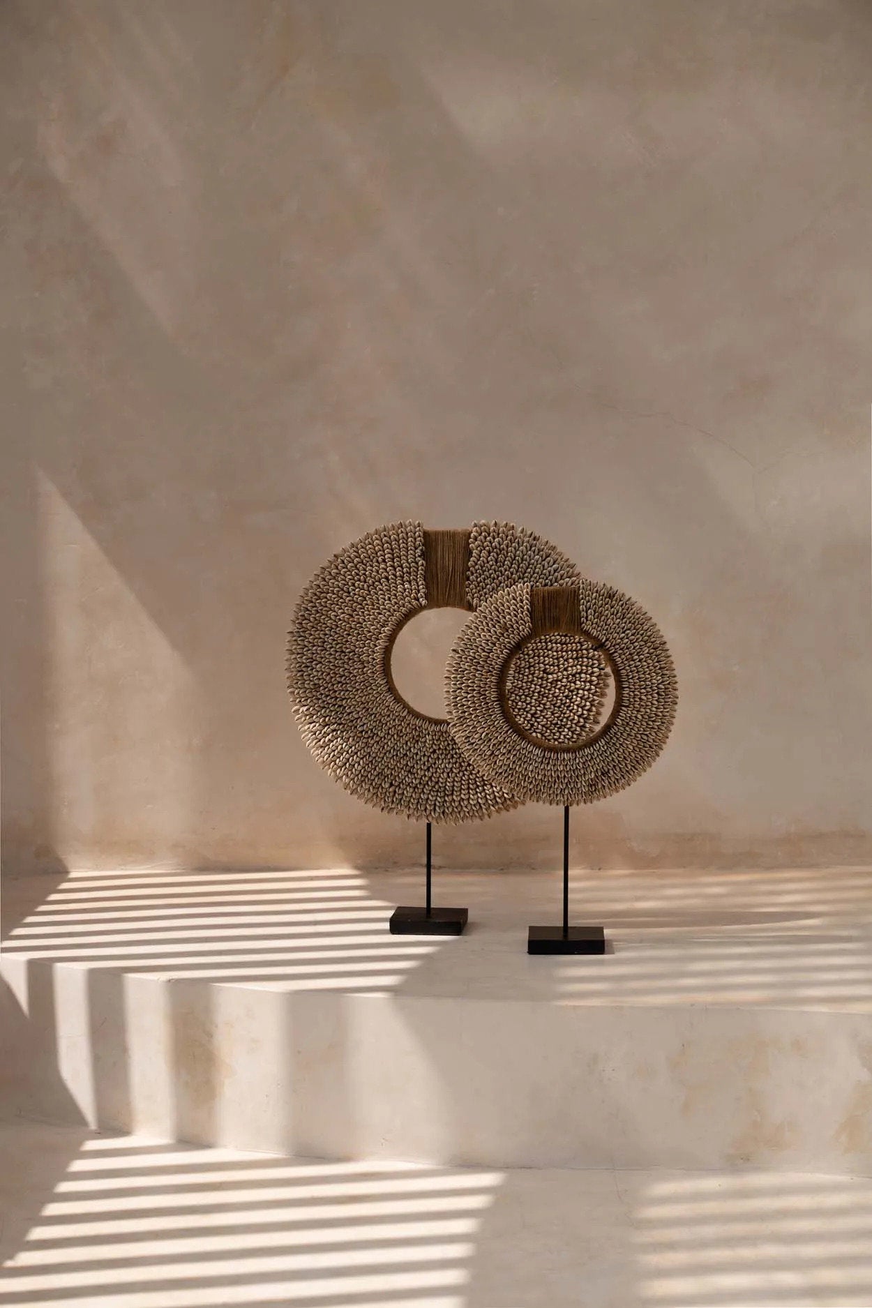 Boho coastal shell ornament on black metal stand