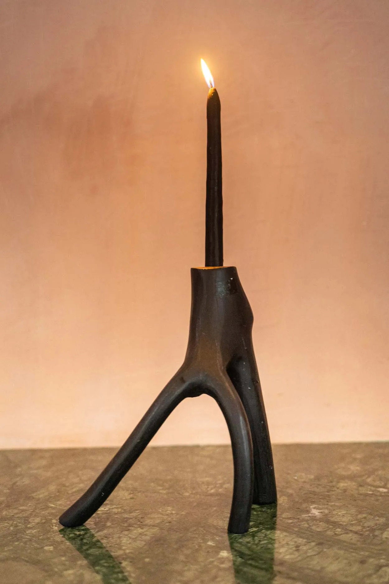 Elegant black wooden candle holder for cozy and artistic home lighting