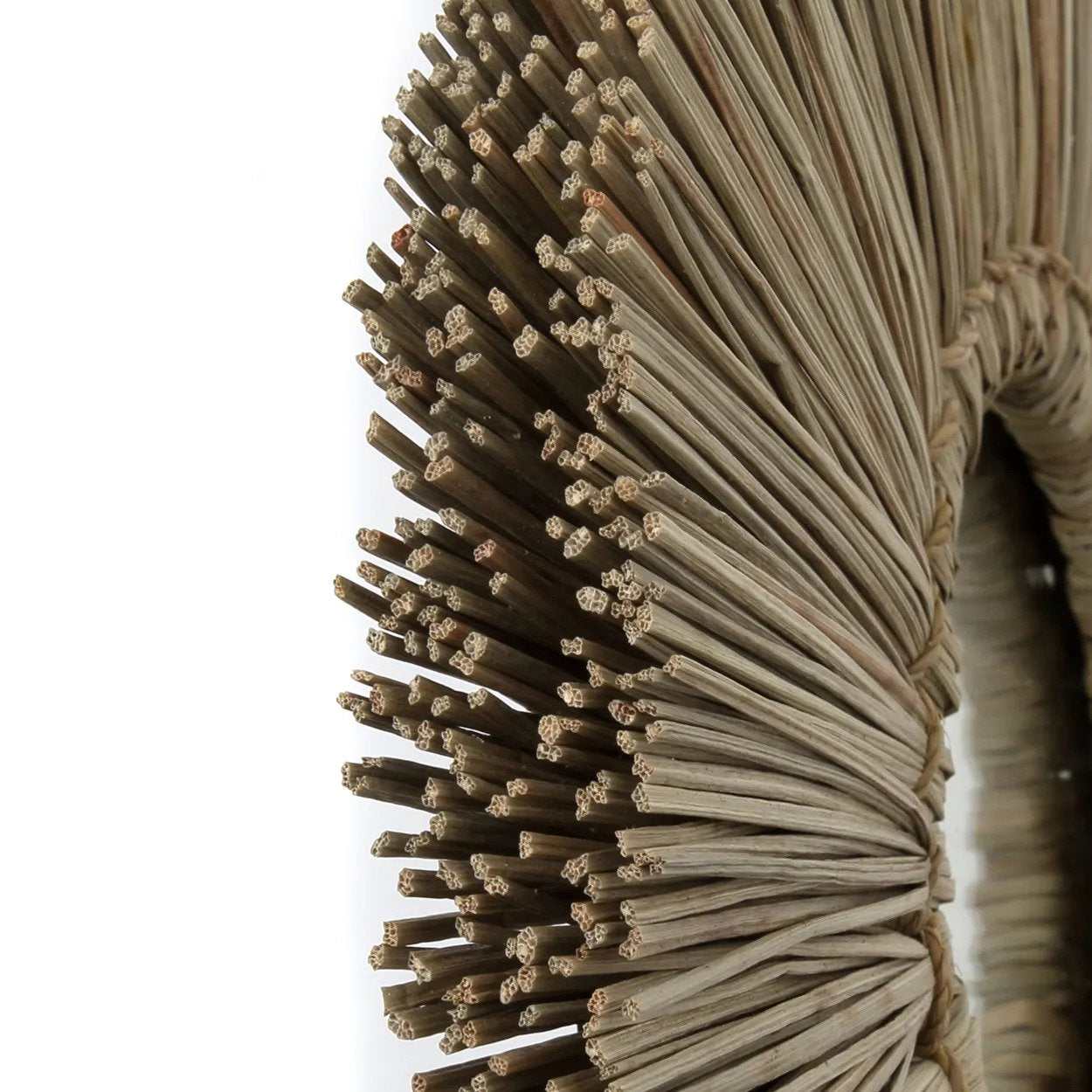 Decorative eco-friendly wall mirror crafted from sustainable grass, perfect for conscious home décor enthusiasts.