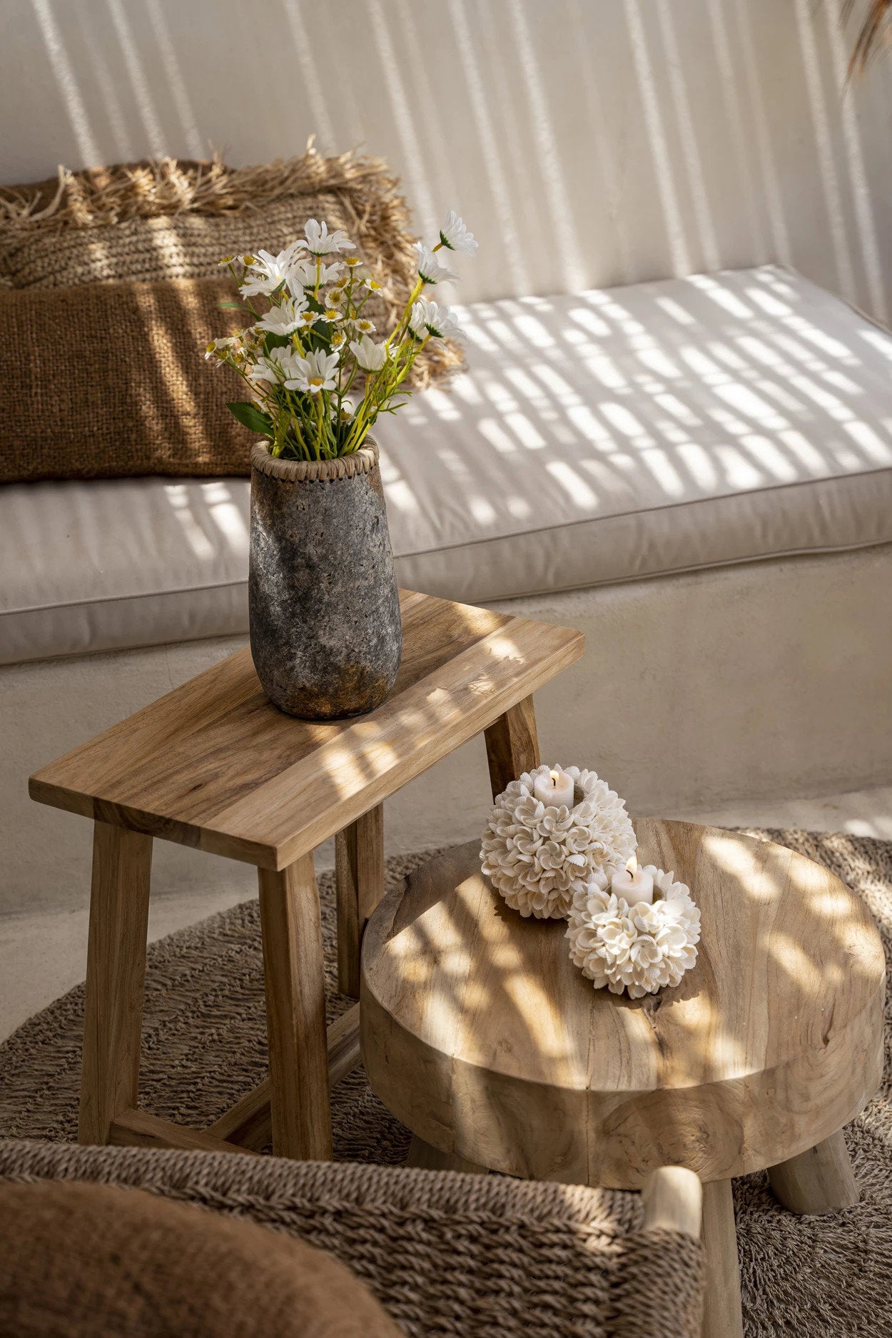 Spherical candle holder with round floral carvings