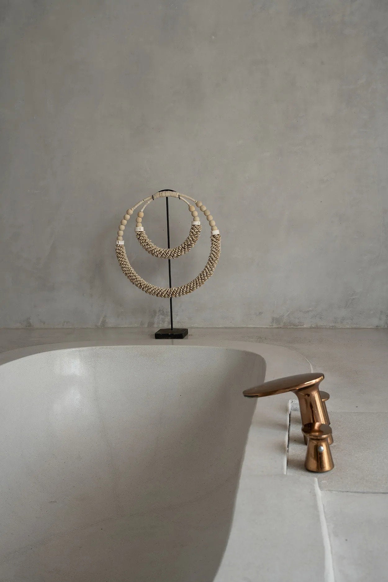 Natural shell décor piece with iron stand