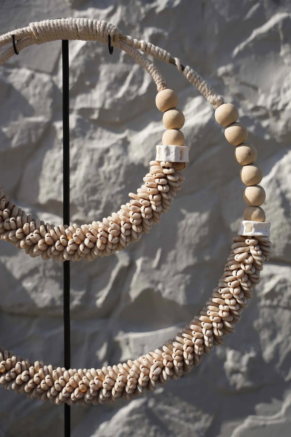 the-double-shell-necklace-on-stand-natural