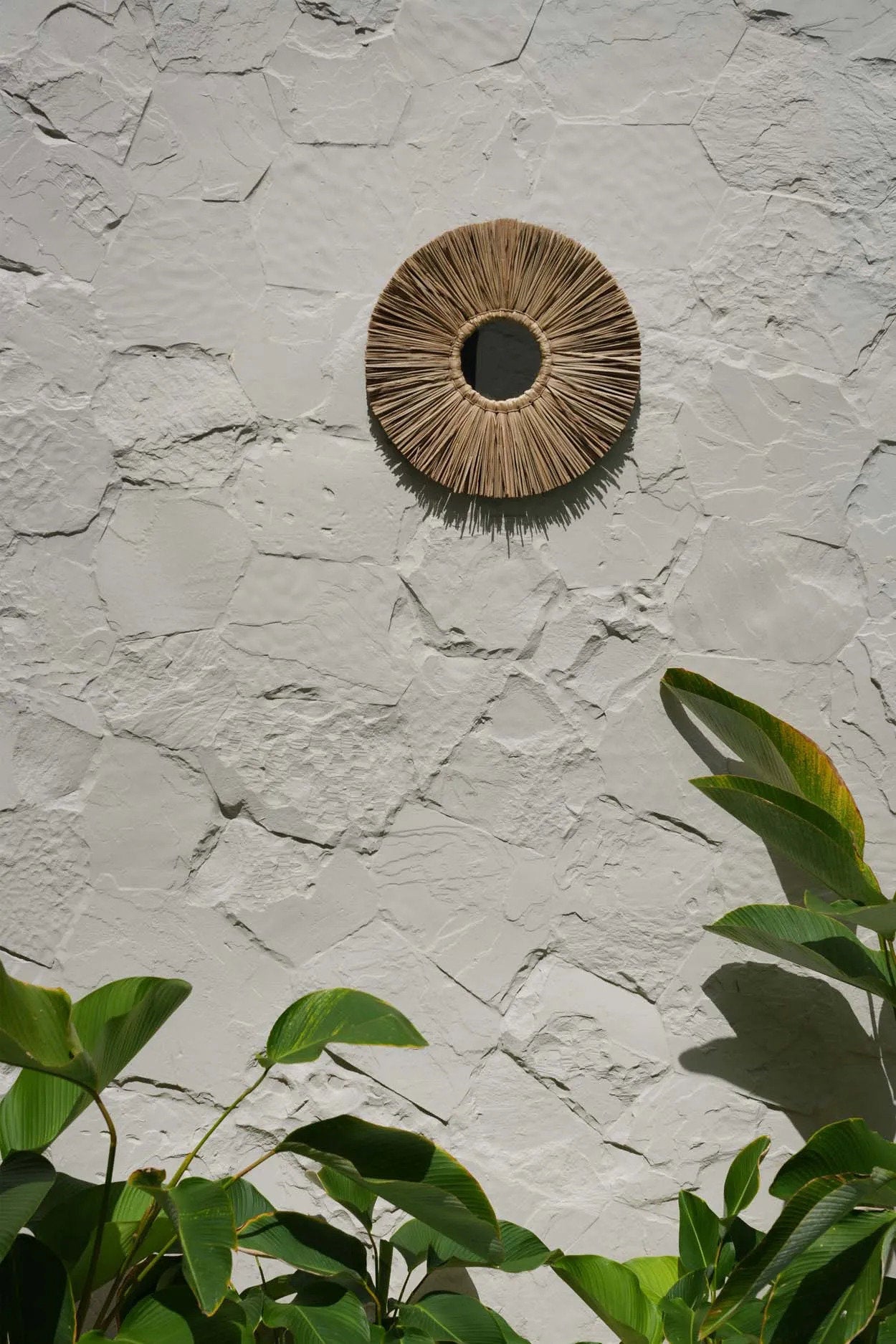 Small round grass mirror showcasing intricate handmade detailing, ideal for living rooms, bedrooms, or cozy corners.