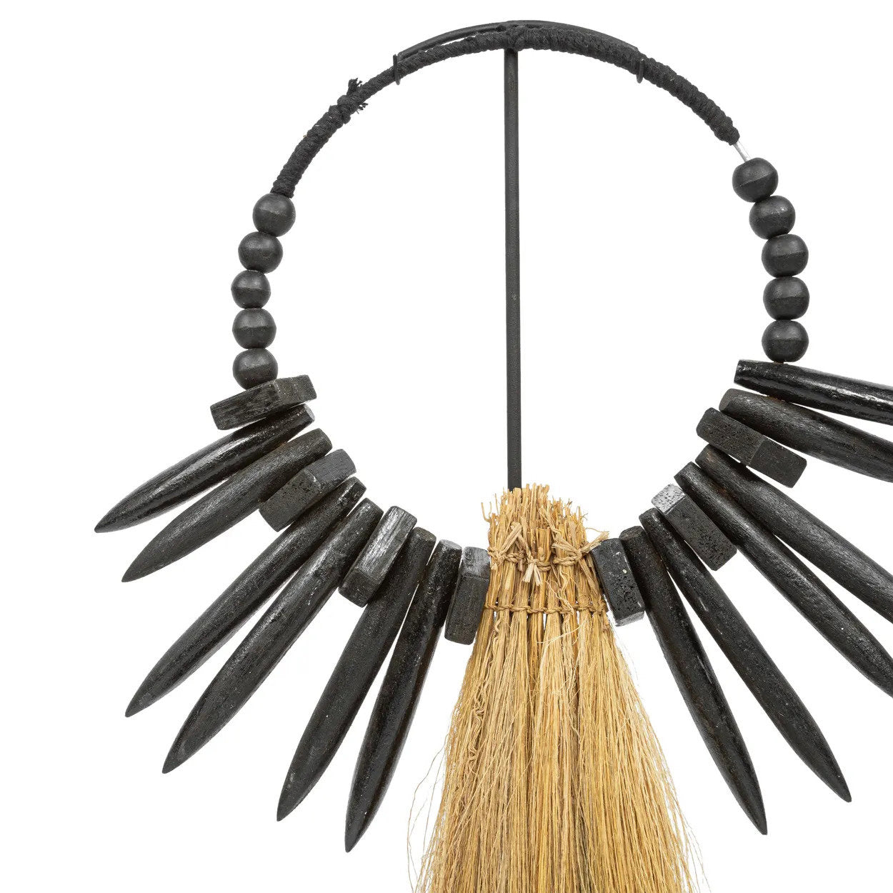 Stylish rayung wood decor piece on black iron base