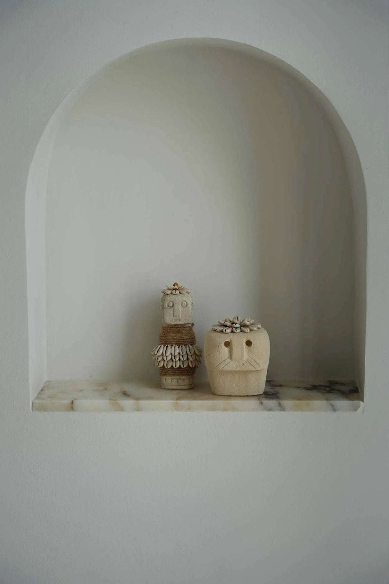 Handmade cultural tribal statue, crafted from durable sandstone with subtle variations in color and texture.