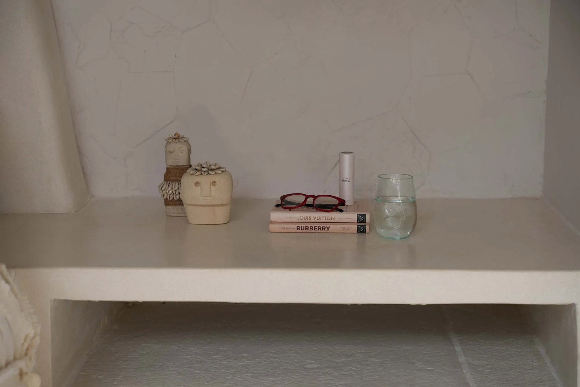 White decorative sculpture featuring playful shell details, adding whimsy and elegance to modern or boho décor.