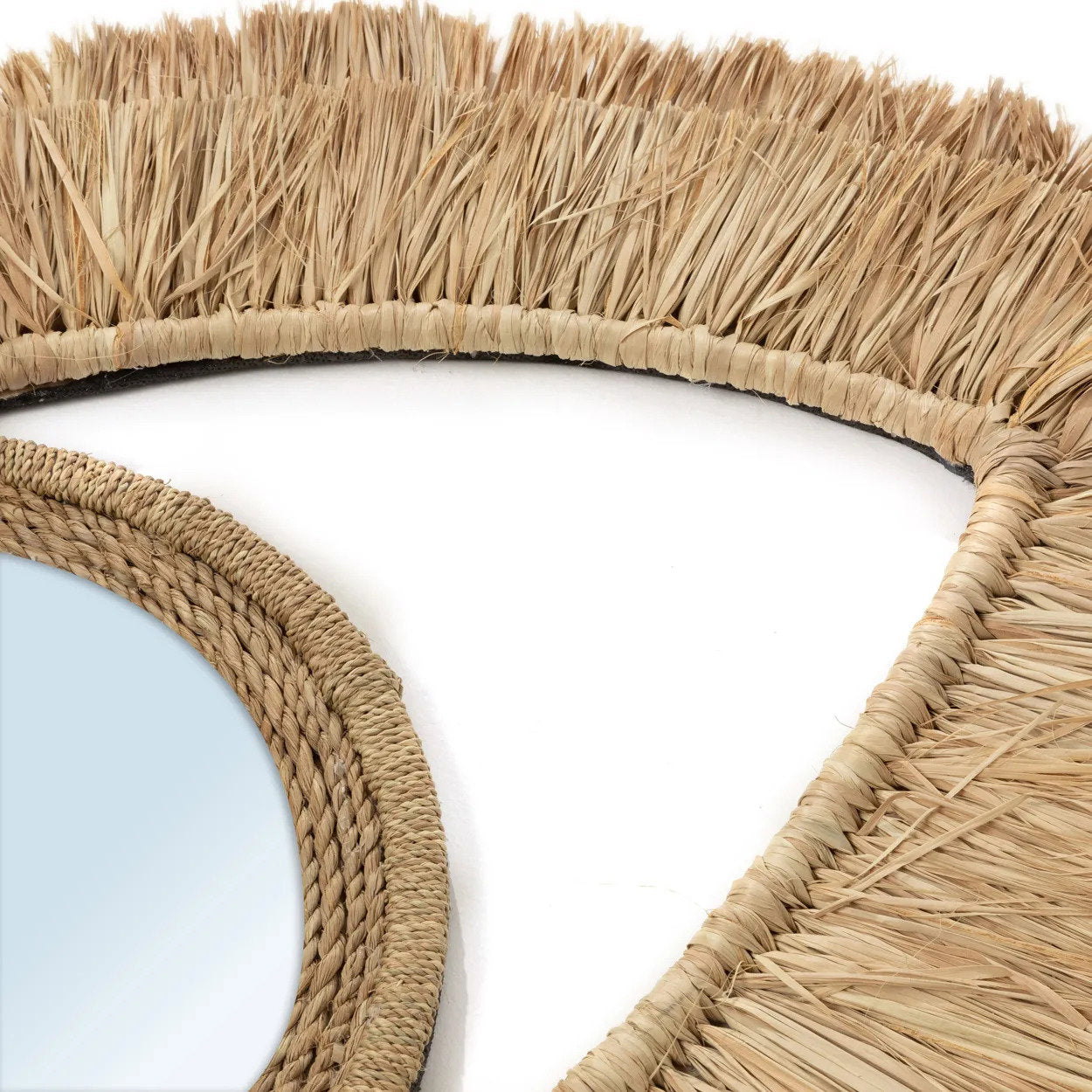 Handmade medium raffia mirror designed to resist weather and rot, suitable for indoor or sheltered outdoor spaces.