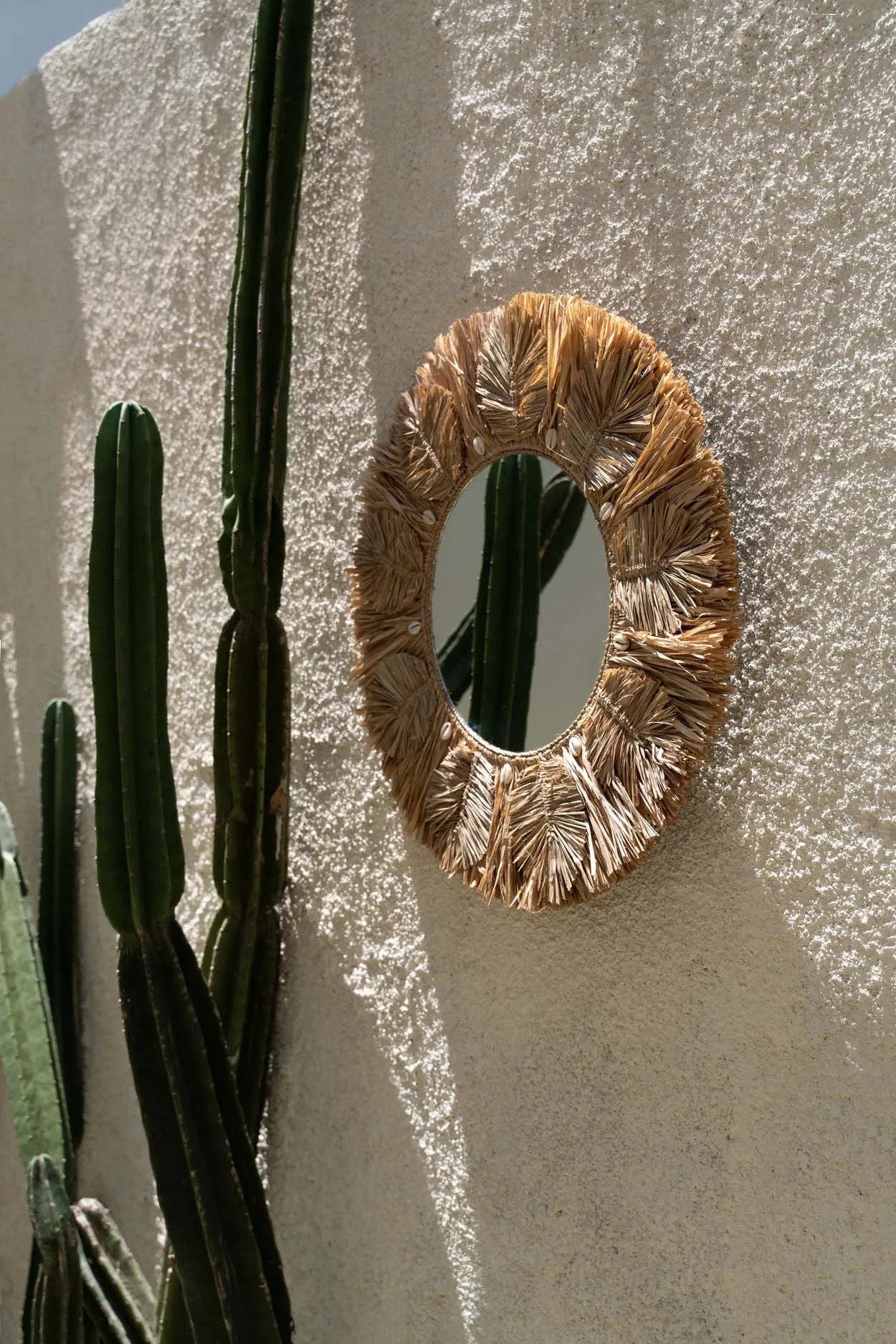 Close-up of the Palm Tree Mirror - Natural - M showing intricate raffia detailing and artisanal craftsmanship.
