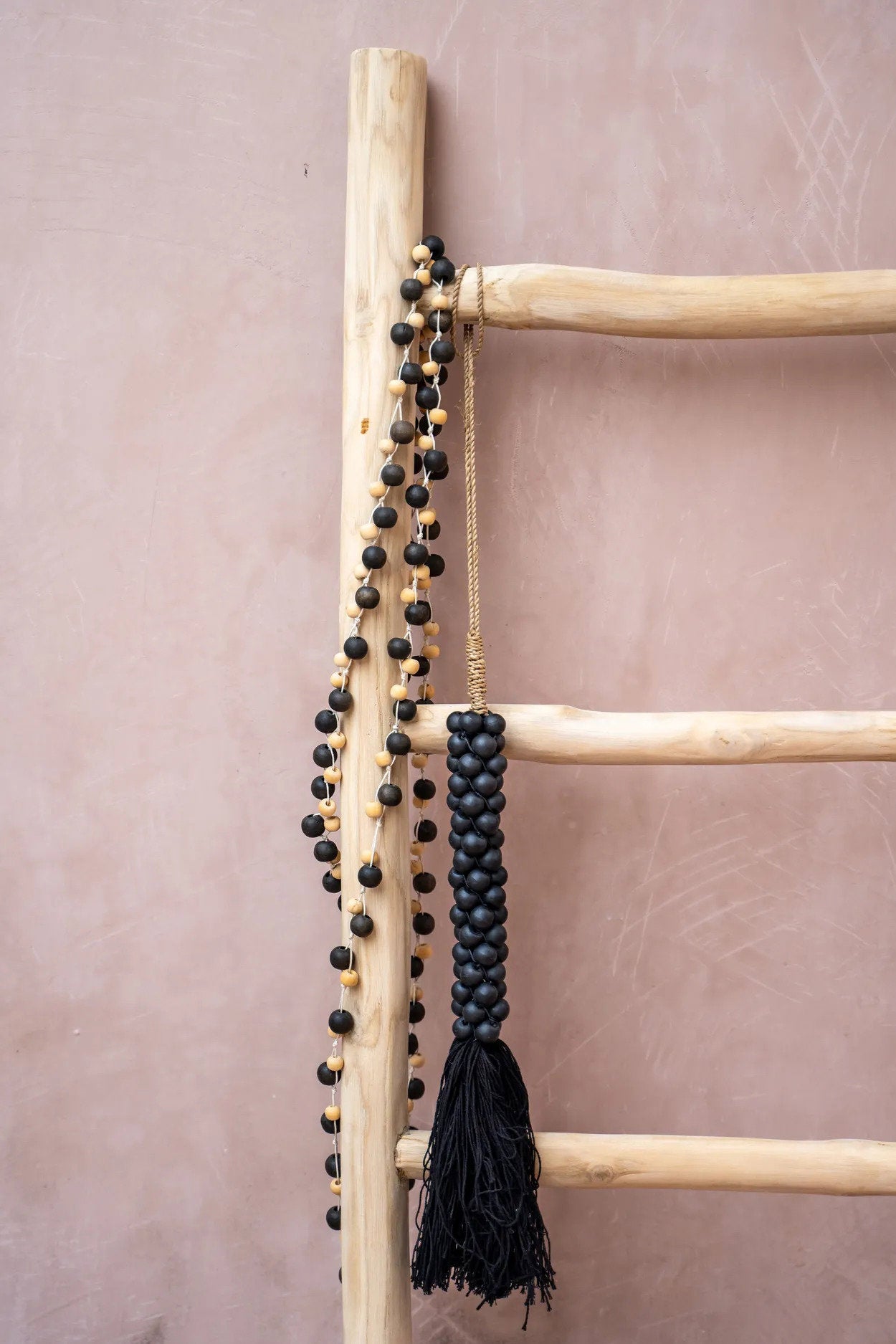 the-wooden-beads-with-cotton-tassel-black