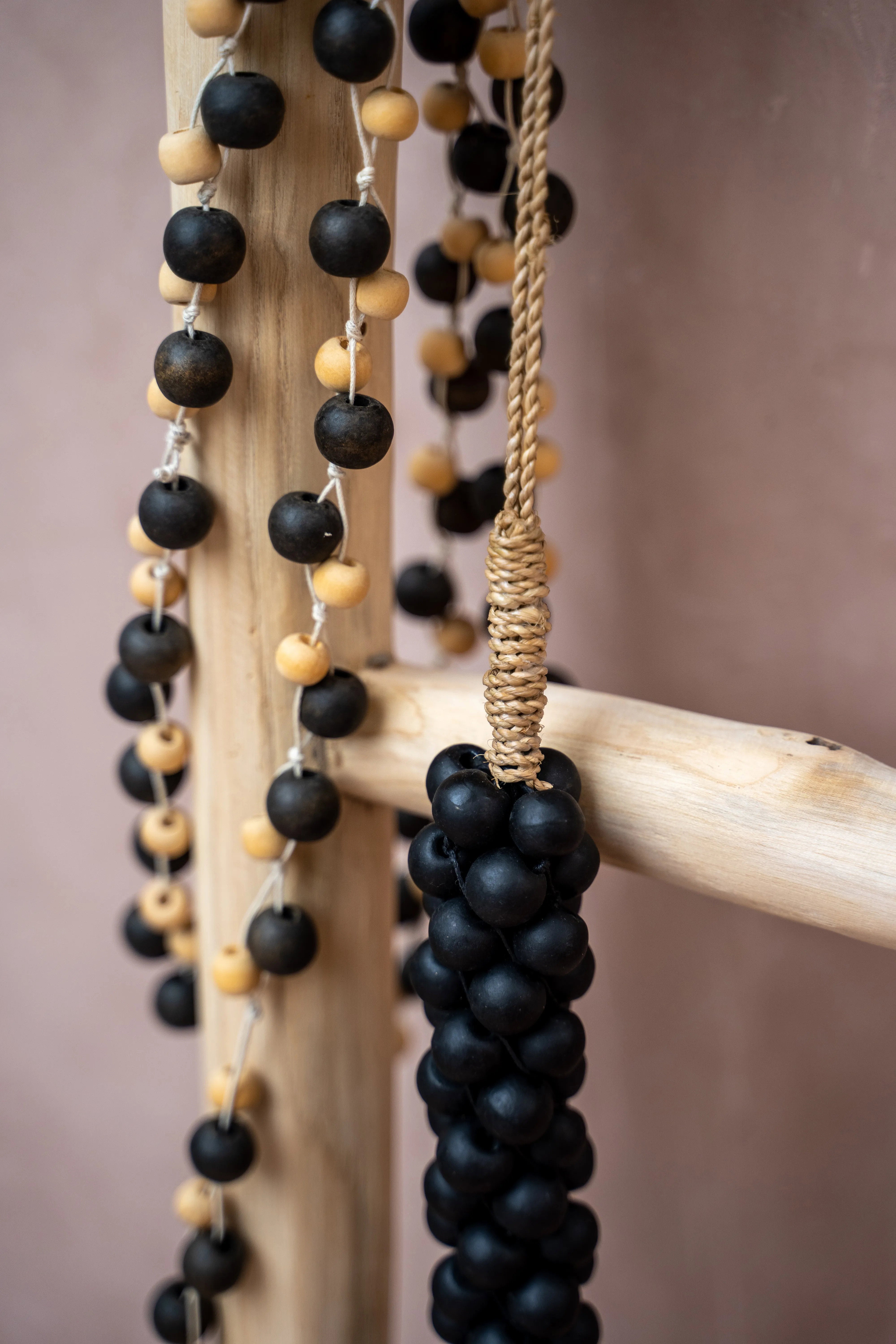 the-wooden-beads-with-cotton-tassel-black