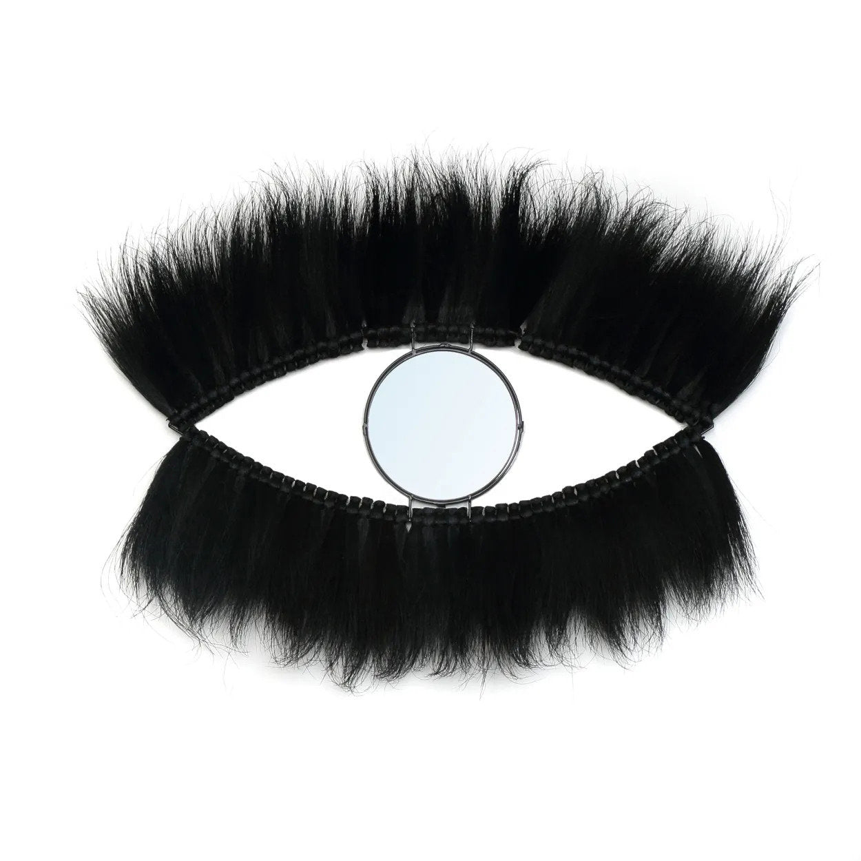 Large black wall mirror with an eye-shaped design, handcrafted from durable grass and sleek glass for modern elegance.