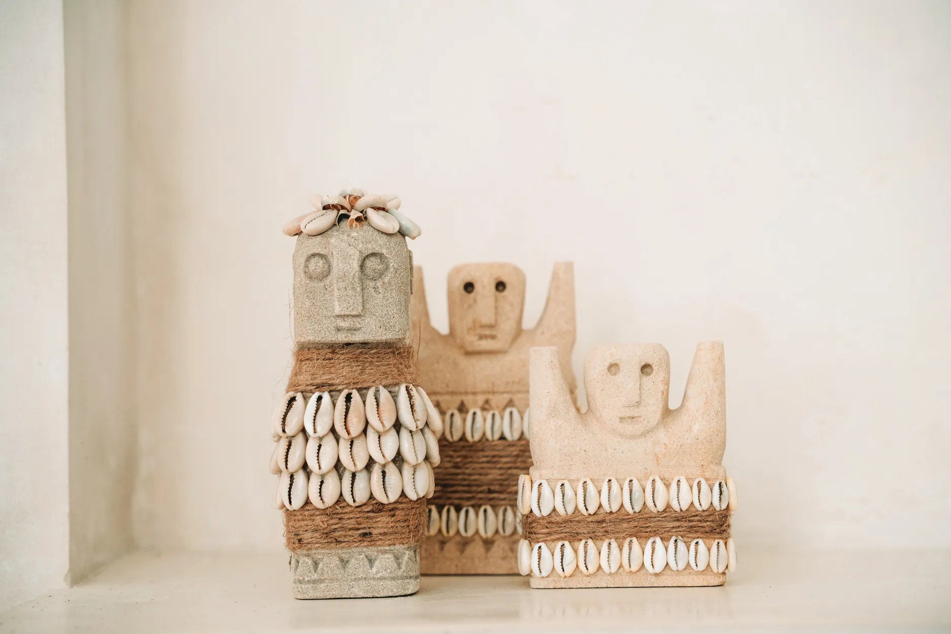 Small tribal stone carving, adding cultural character and charm to modern or eclectic interiors.