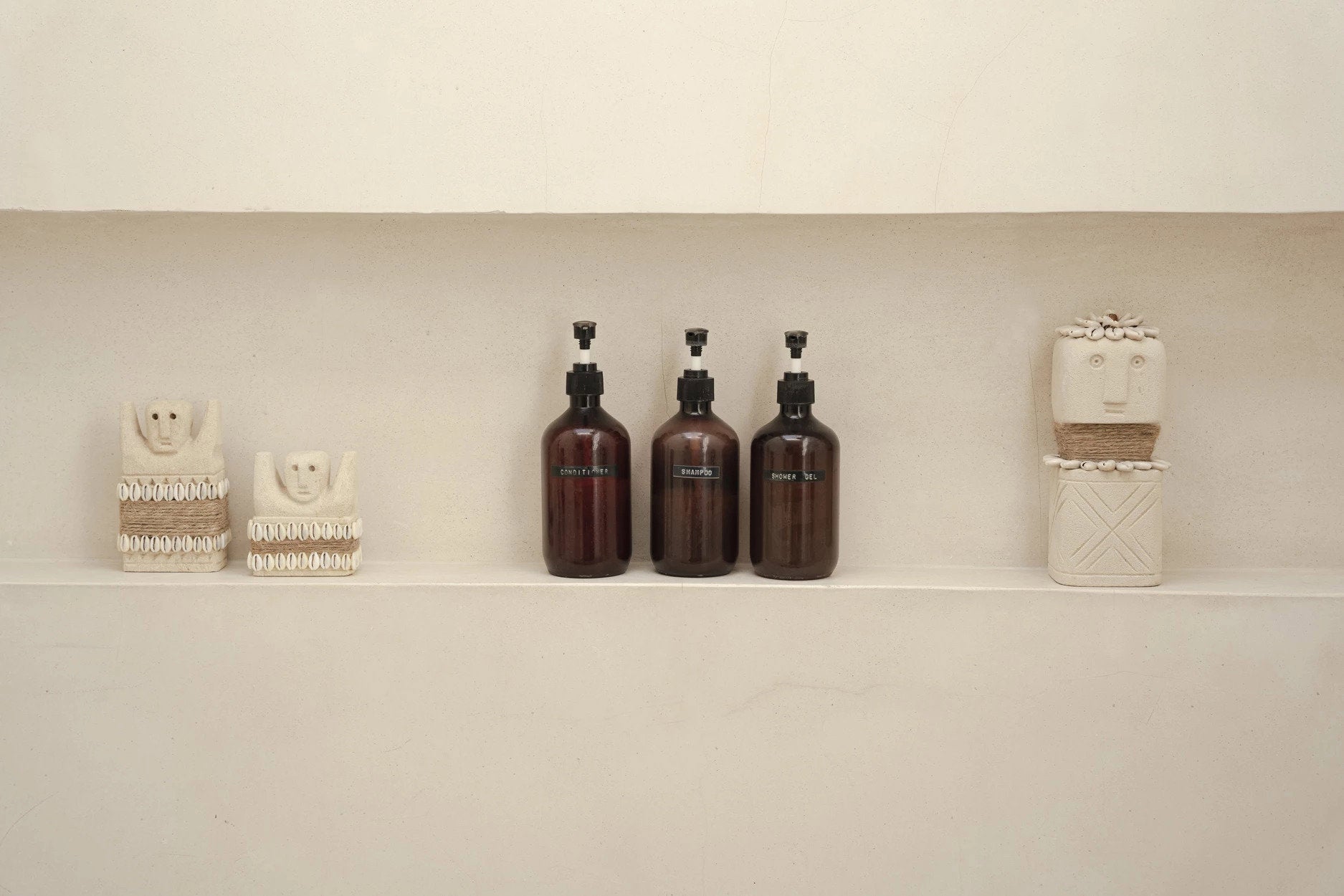 Handmade sandstone sculpture with subtle color and finish variations, making each piece unique.