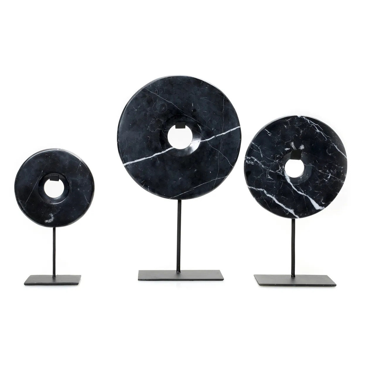 Bold and elegant black marble disc on stand for minimalistic décor
