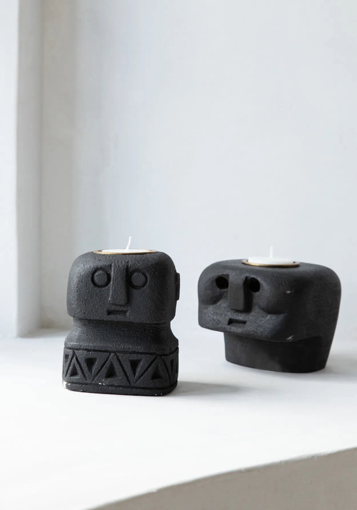 Artisan-crafted sandstone candle holder for warm, ambient lighting