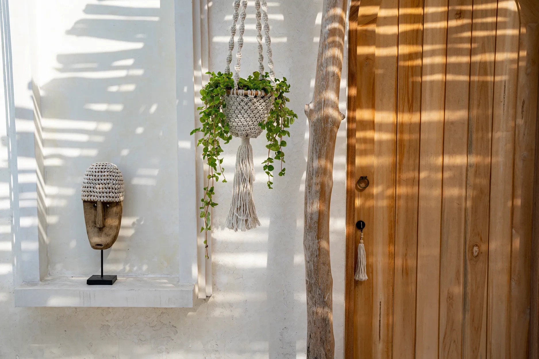 the-cowrie-mask-on-stand-medium