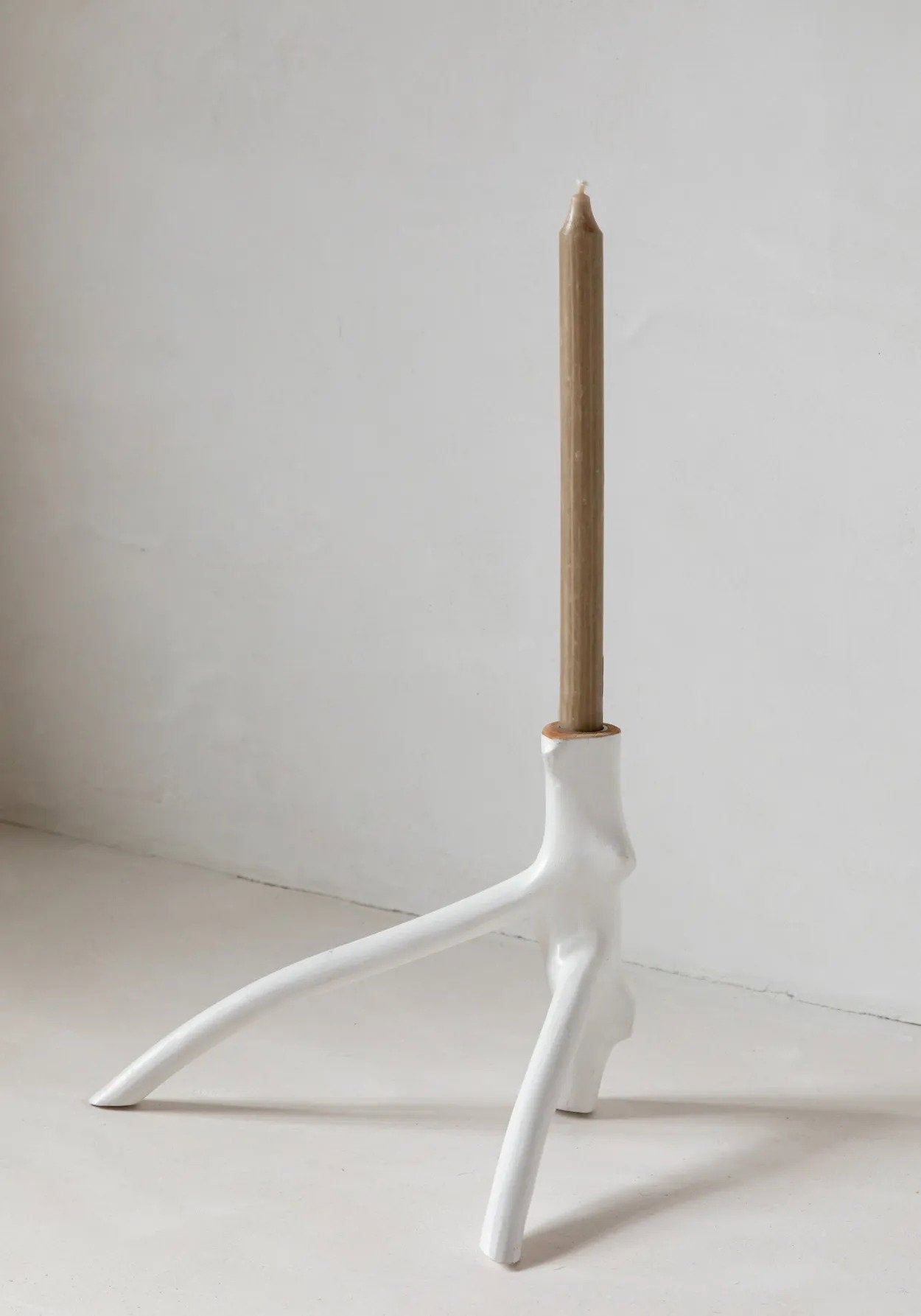 White candle holder crafted from real wood with natural texture