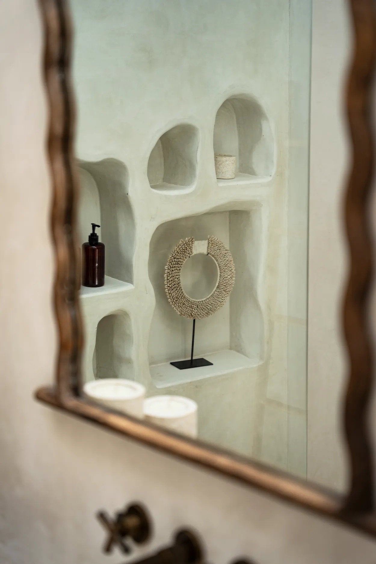 Refined shell stand with earthy white tone and artisanal shell arrangement