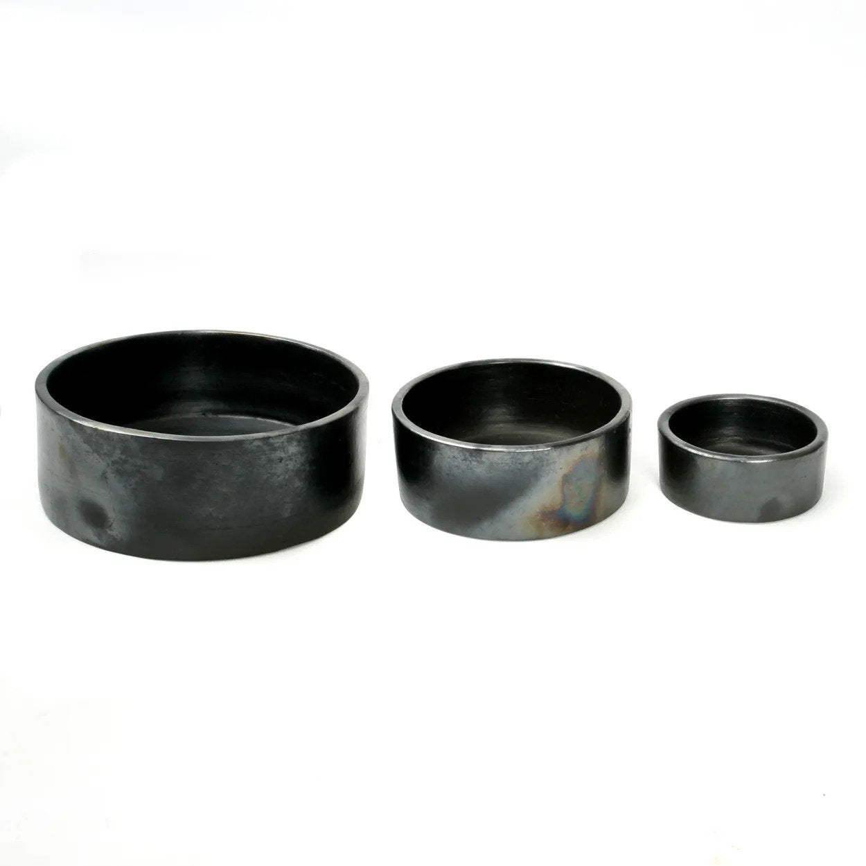 The Burned Cylinder Dish set of 3, handmade black ceramic dishes perfect for everyday meals and serving stews or sides.